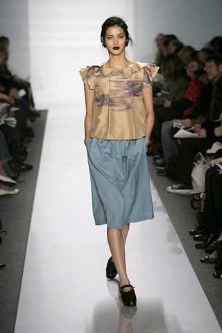 beige silk ruffled top with blue midi skirt
