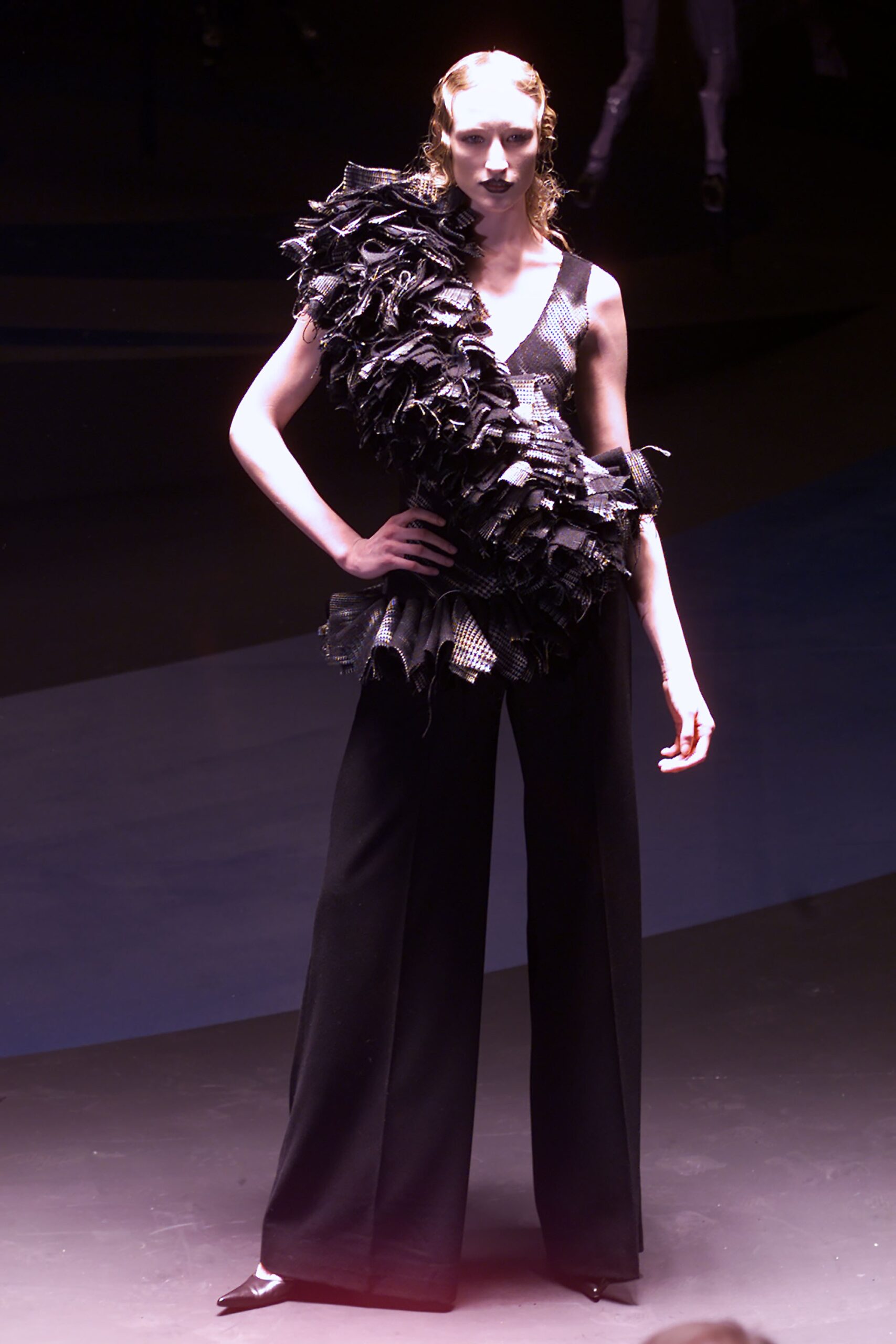 black ruffled top with wide-leg pants