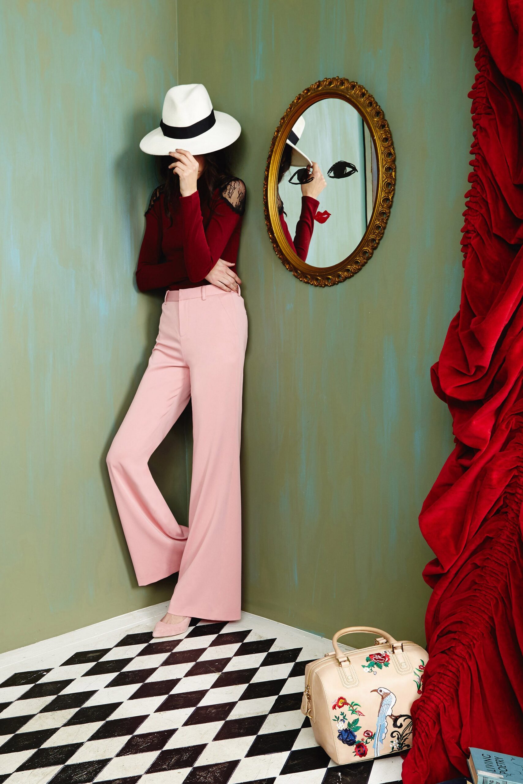 red fitted top with pink tailored pants