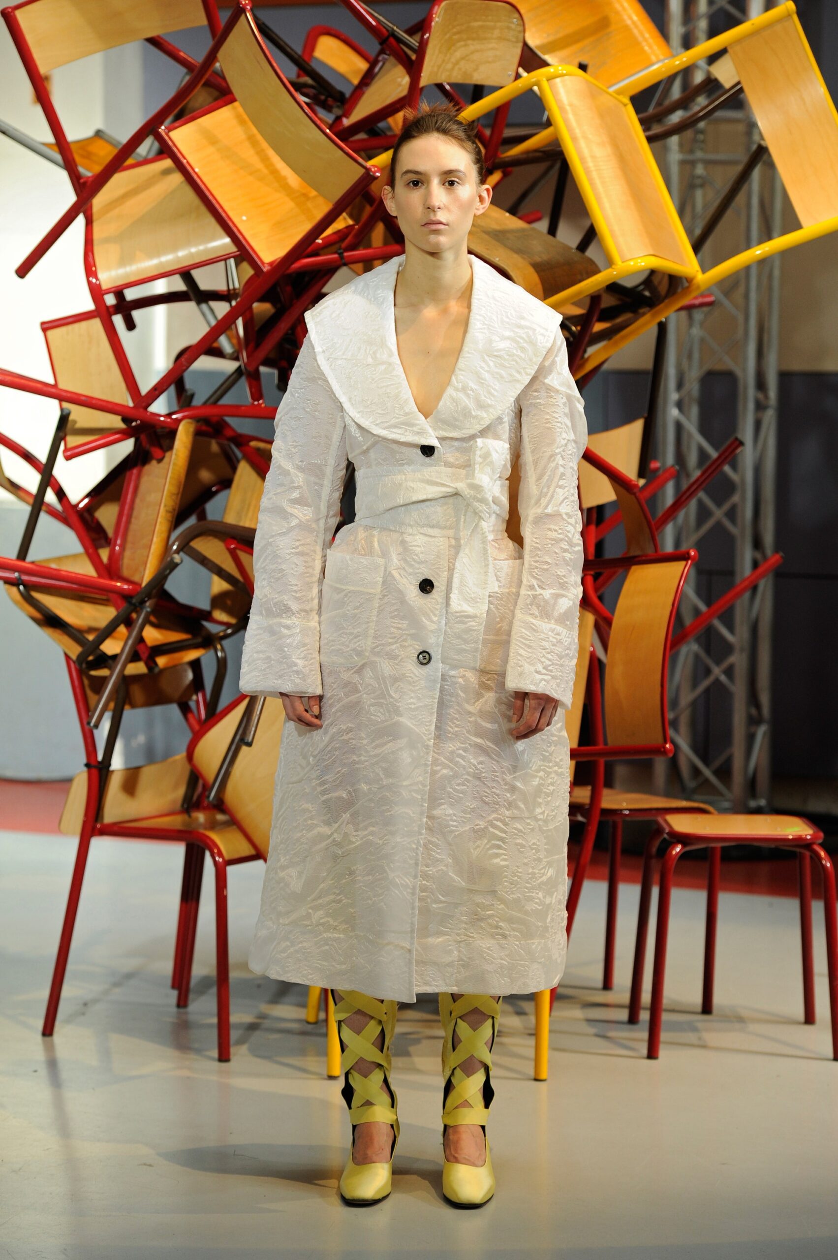 white fitted coat with yellow shoes