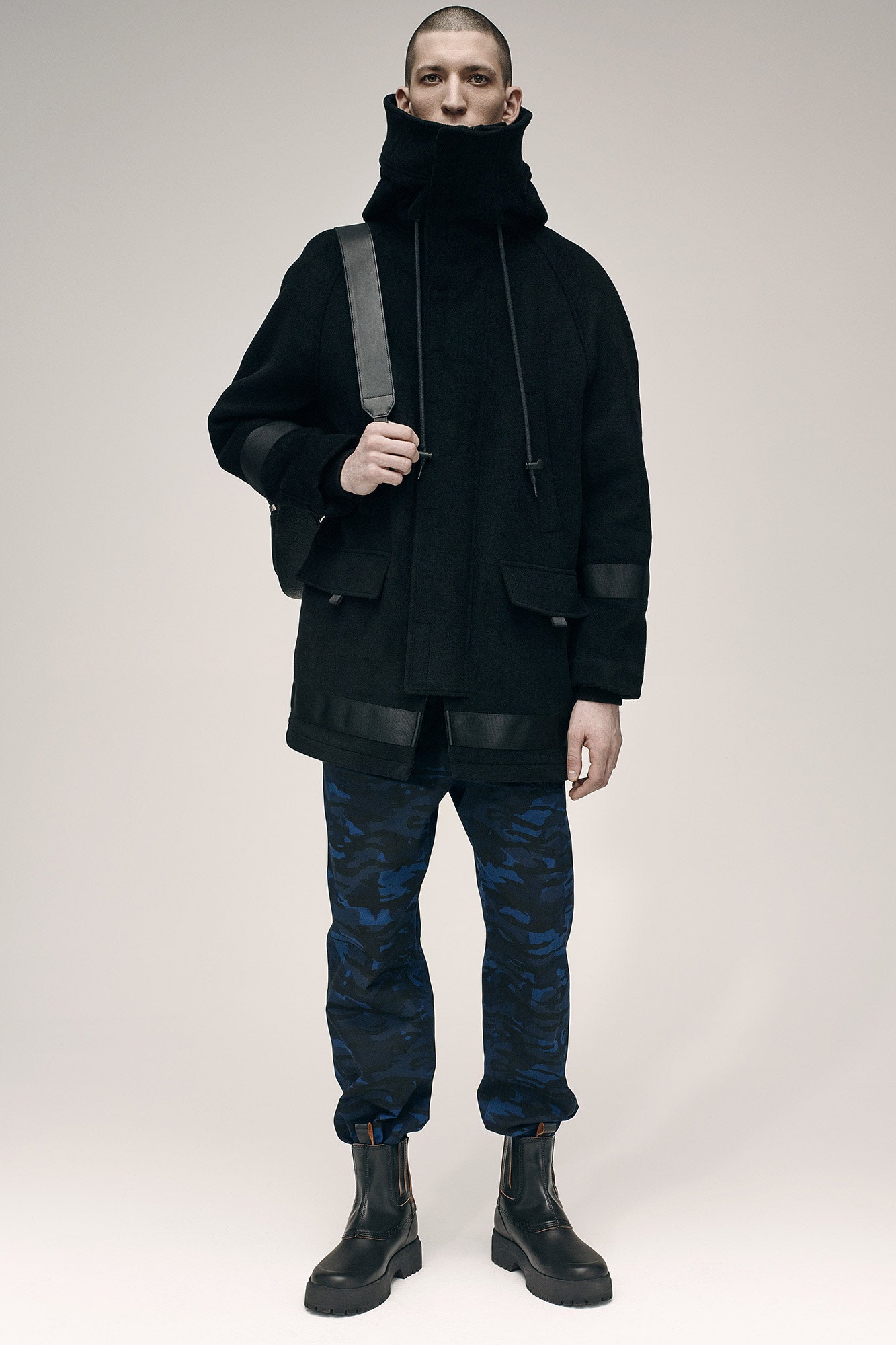 black wool coat with cargo pants