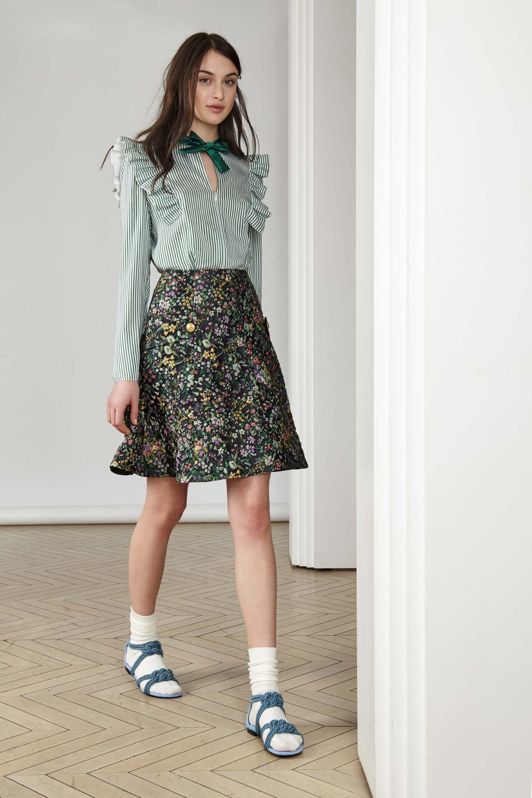 green striped ruffled blouse and floral skirt