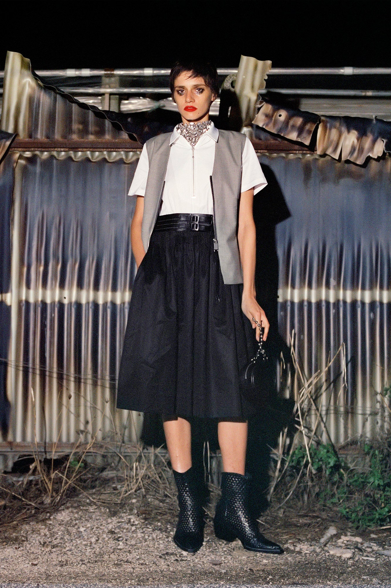 gray vest white shirt black skirt