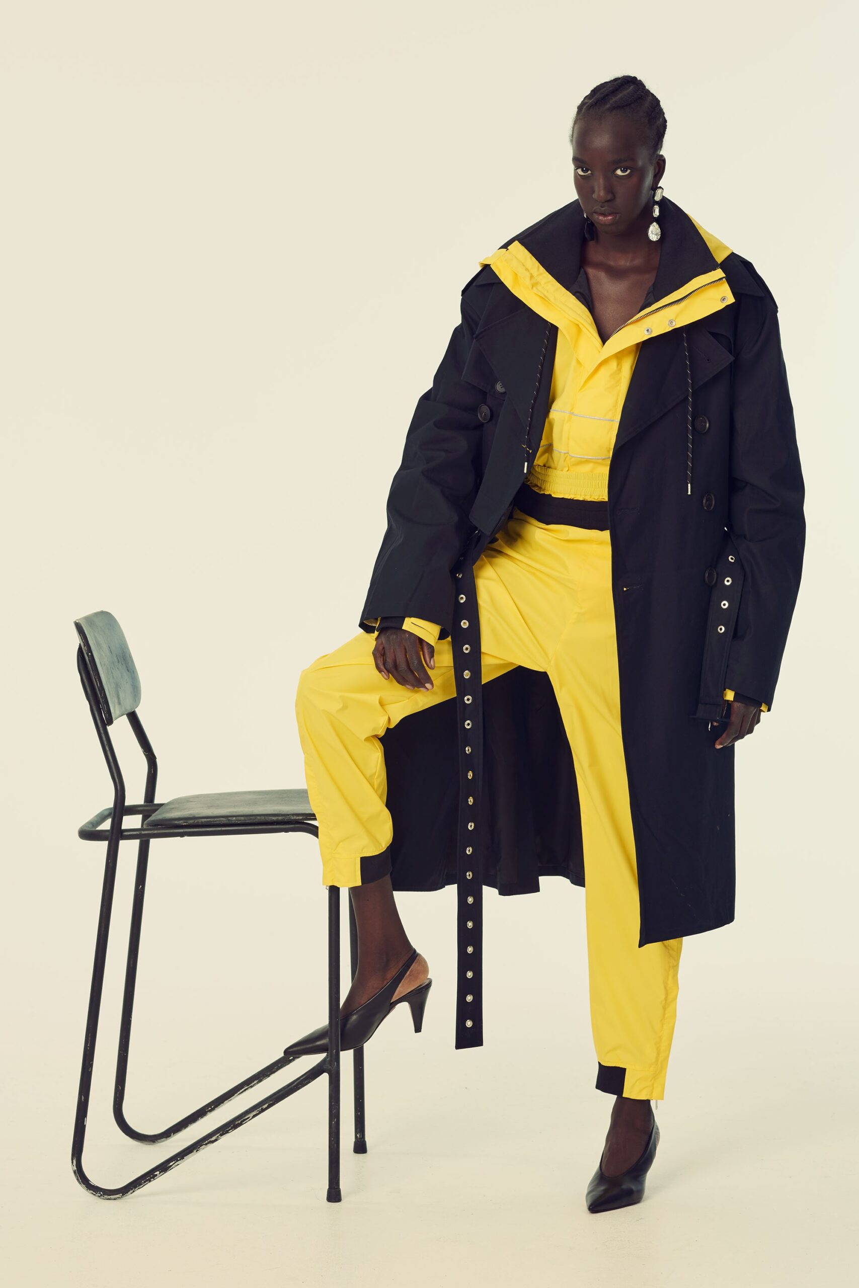 black trench coat and yellow jumpsuit