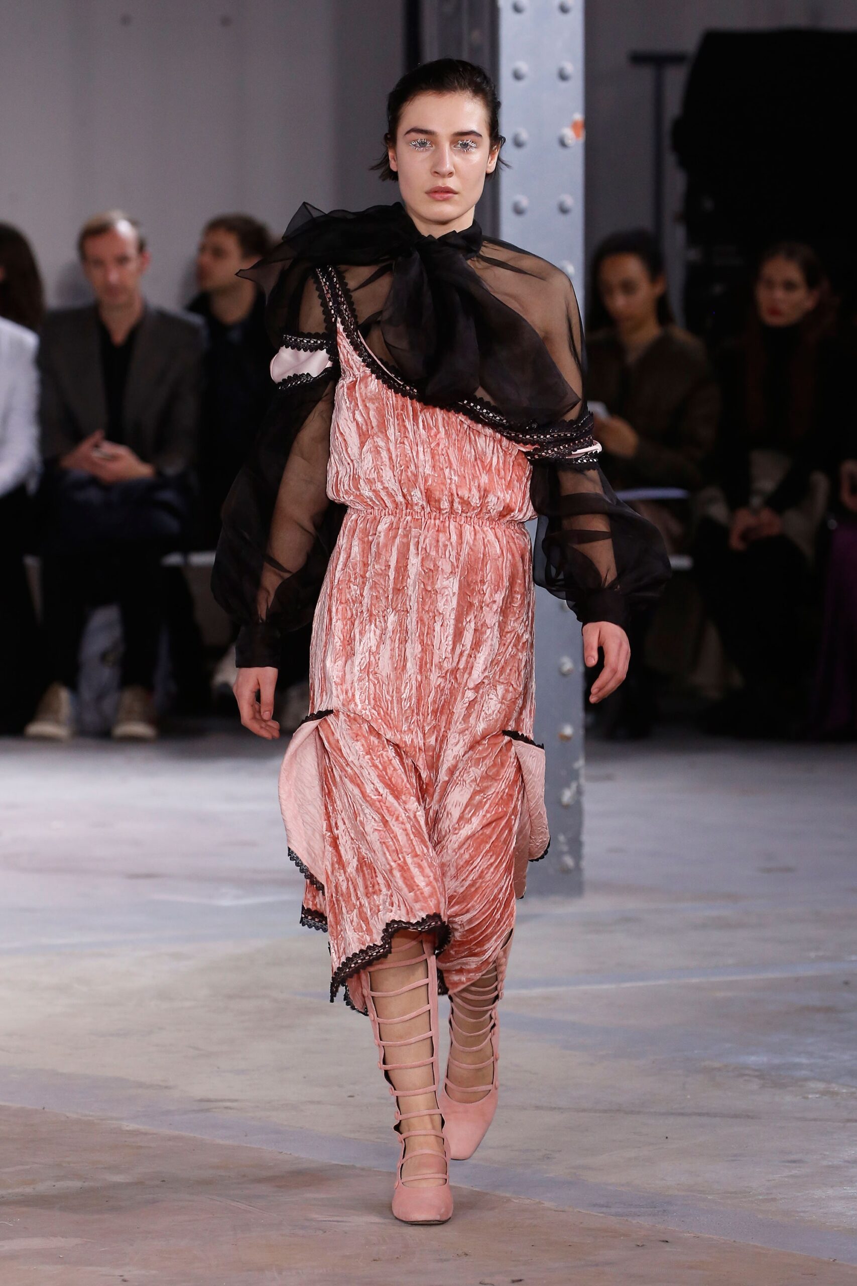 pink pleated midi dress with black blouse