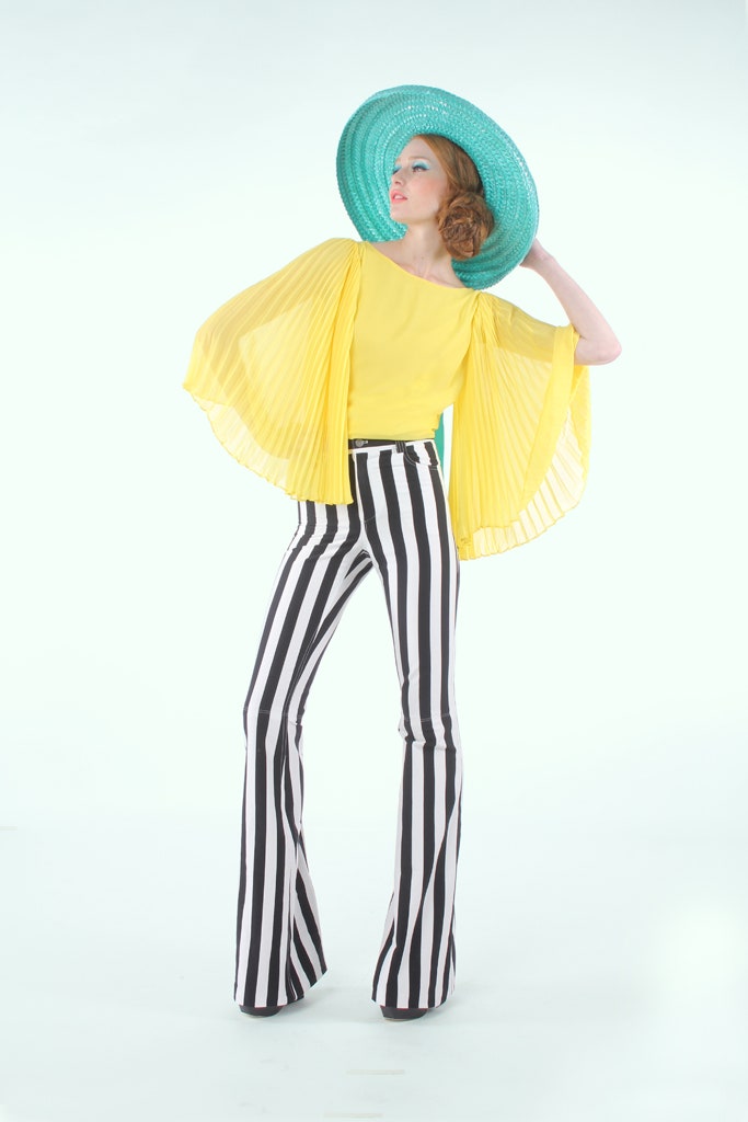yellow silk sleeveless high-neck fitted pleated flowing top