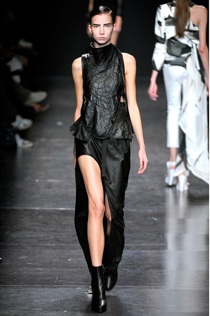 black leather sleeveless dress and boots
