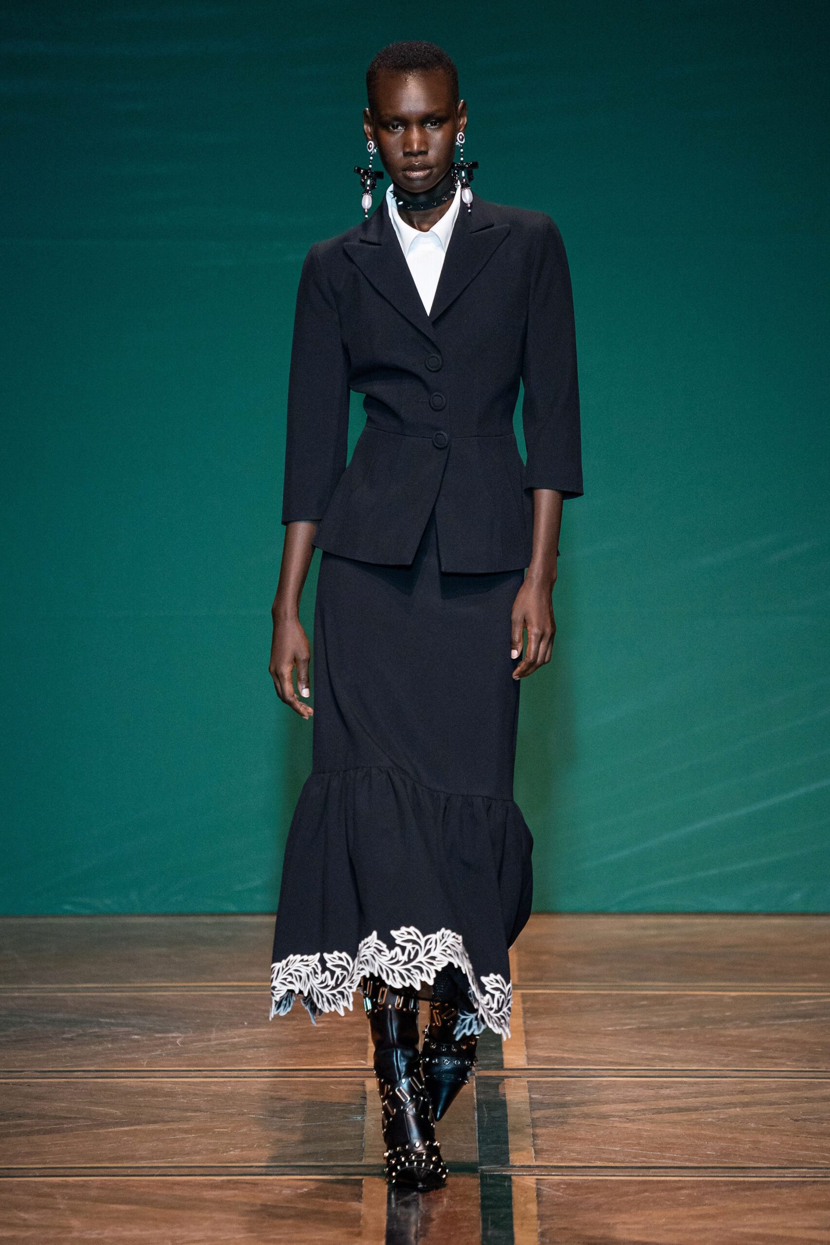 black tailored blazer and flared skirt