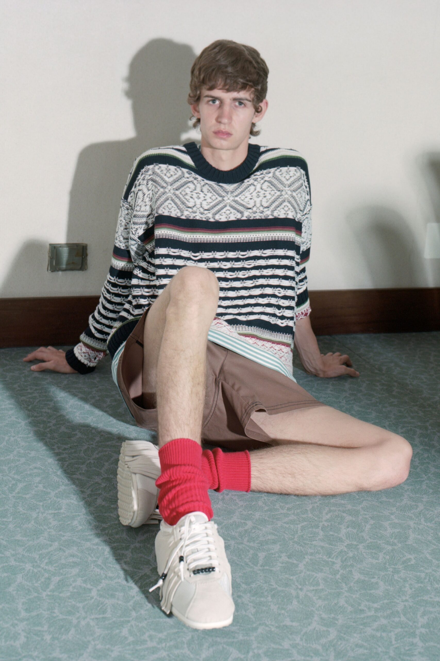 relaxed blue striped sweater with beige shorts