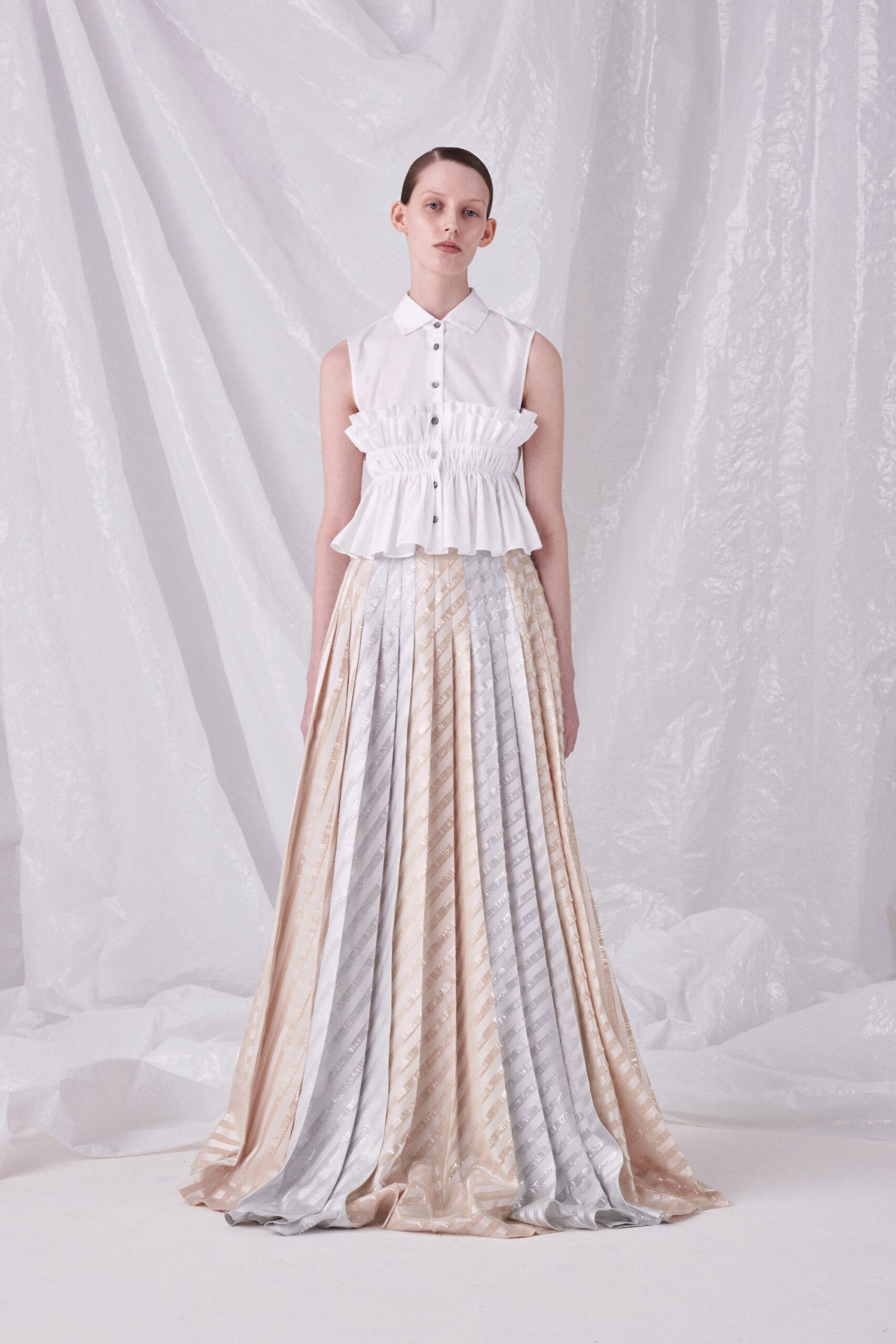 white cotton sleeveless collared fitted ruffled top