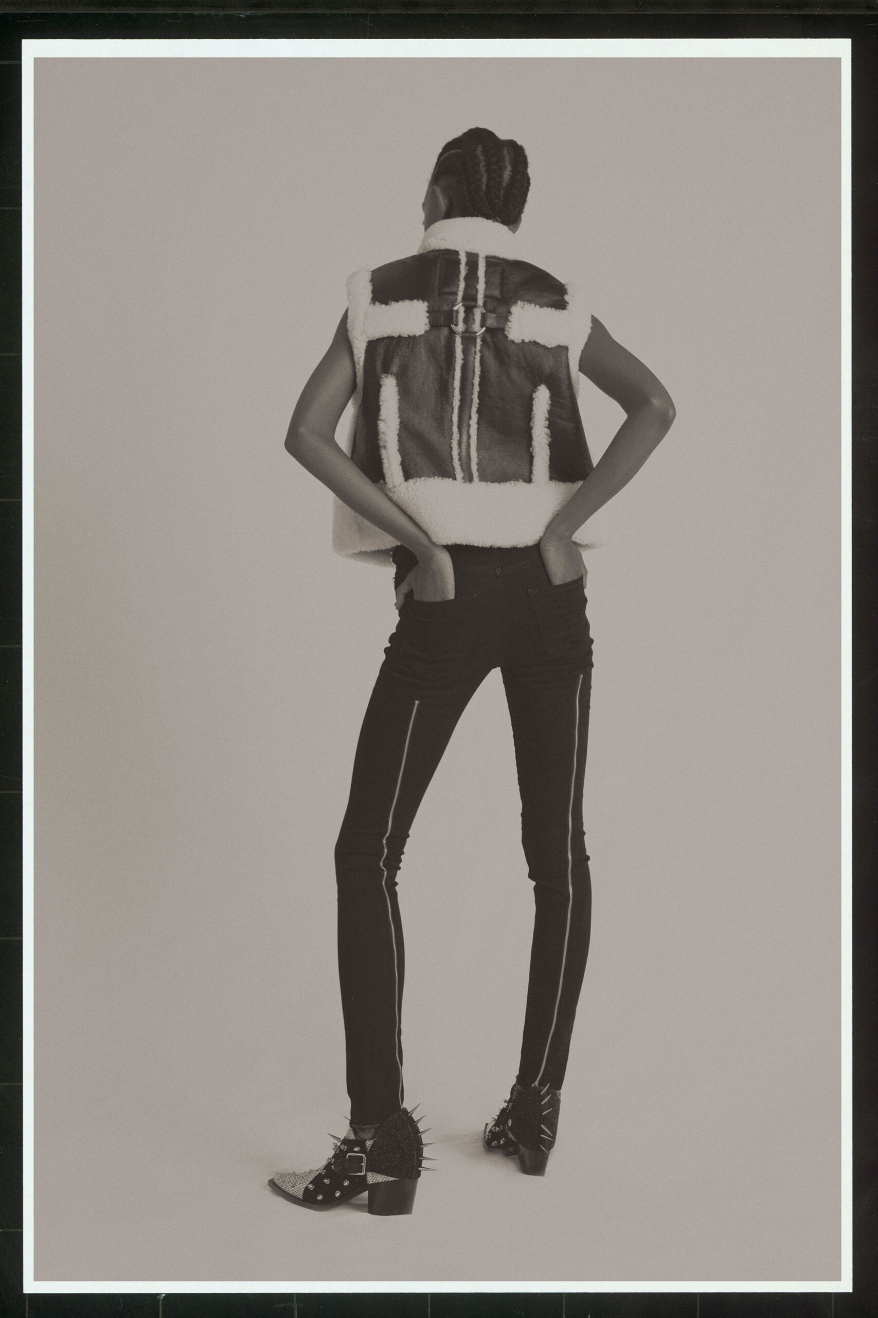 black and white fur vest with slim jeans