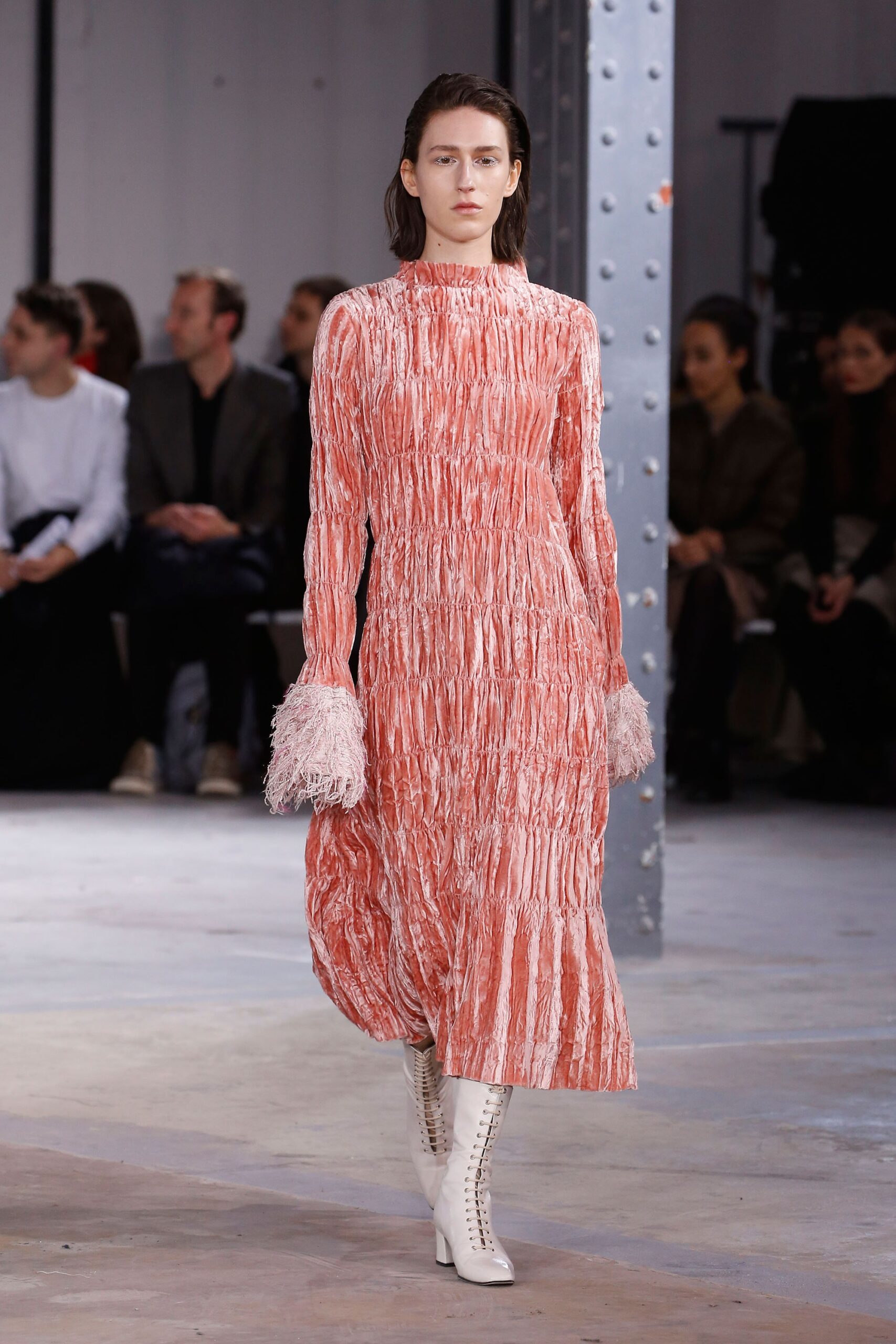 pink pleated midi dress with white boots