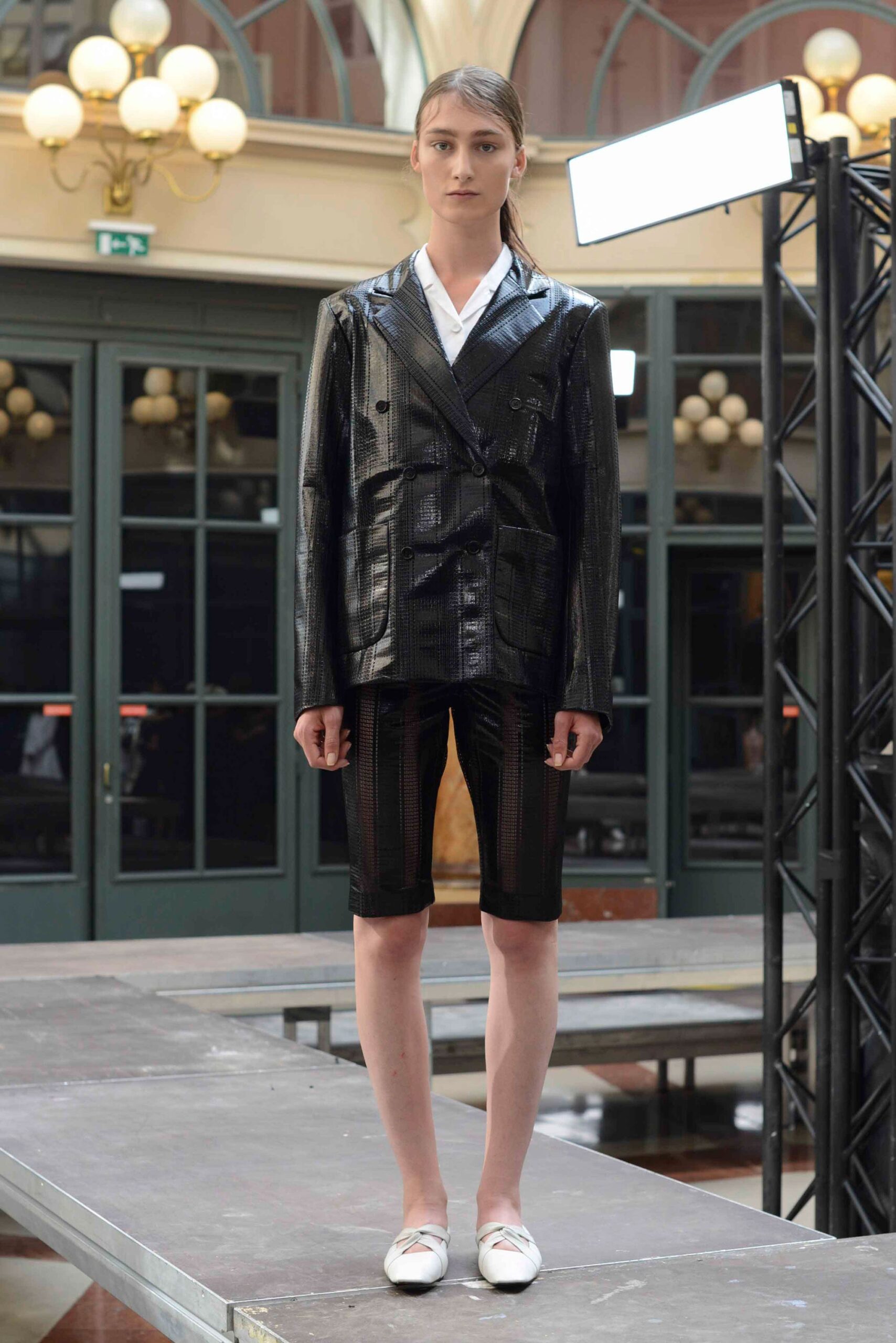 black vinyl long-sleeve collared fitted textured shiny blazer