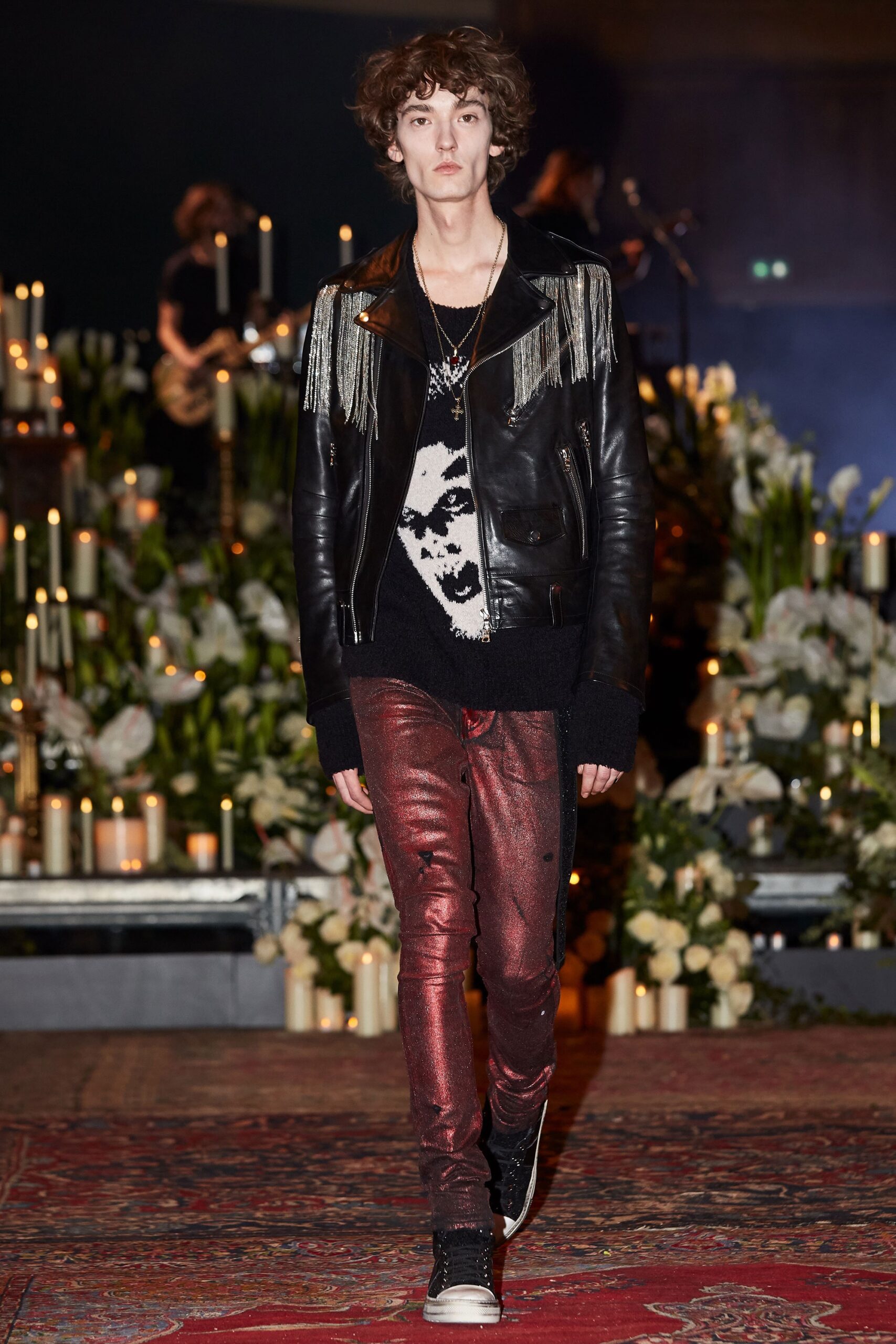 black leather jacket with red pants
