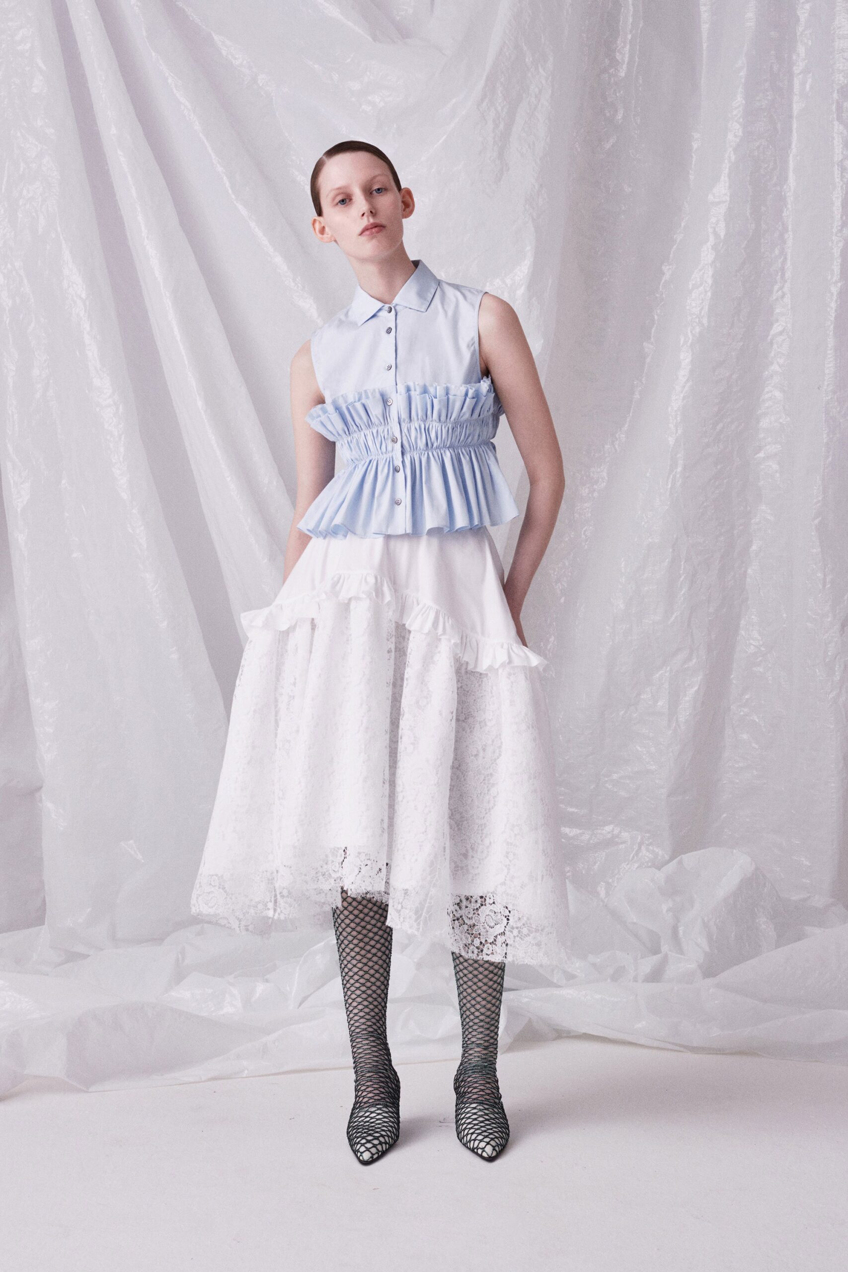 blue cotton sleeveless top with white lace skirt