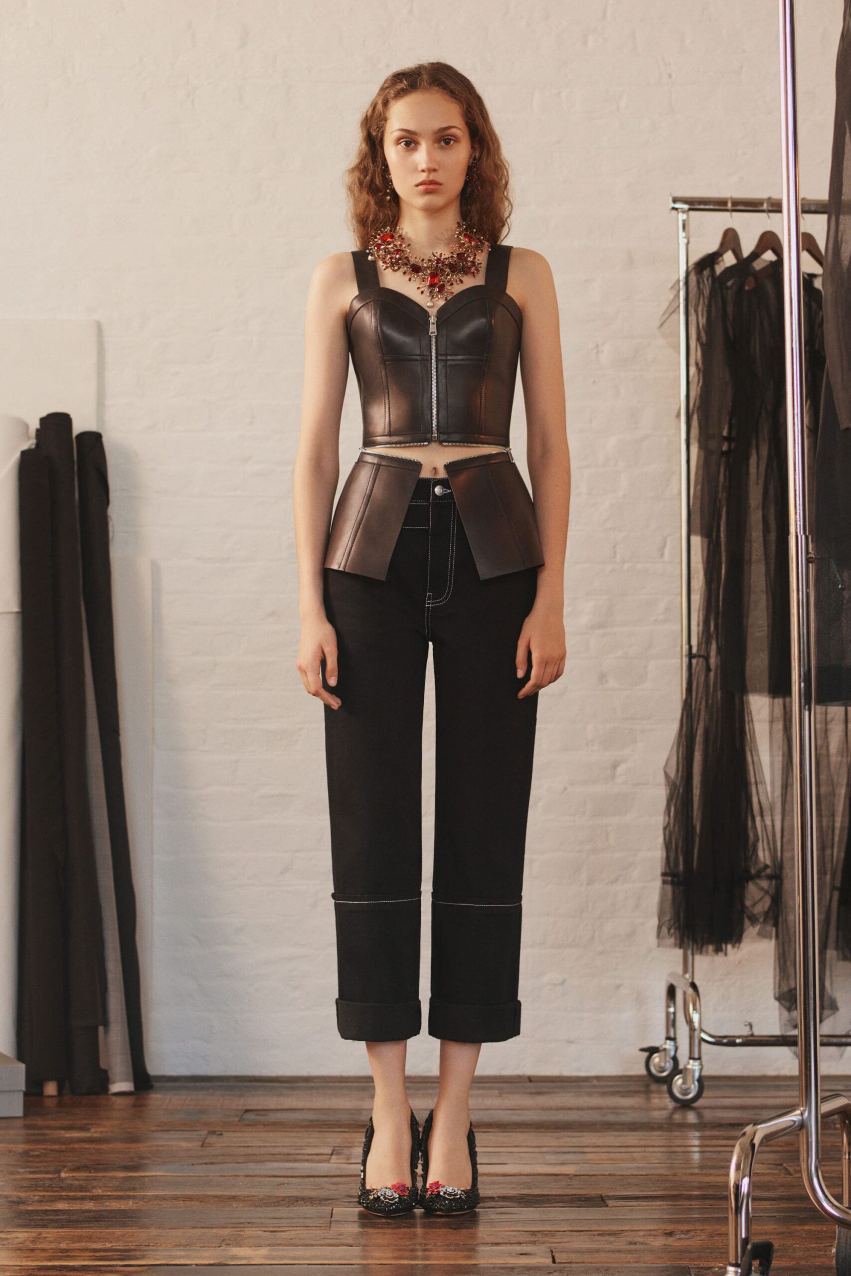 black leather fitted top and relaxed pants