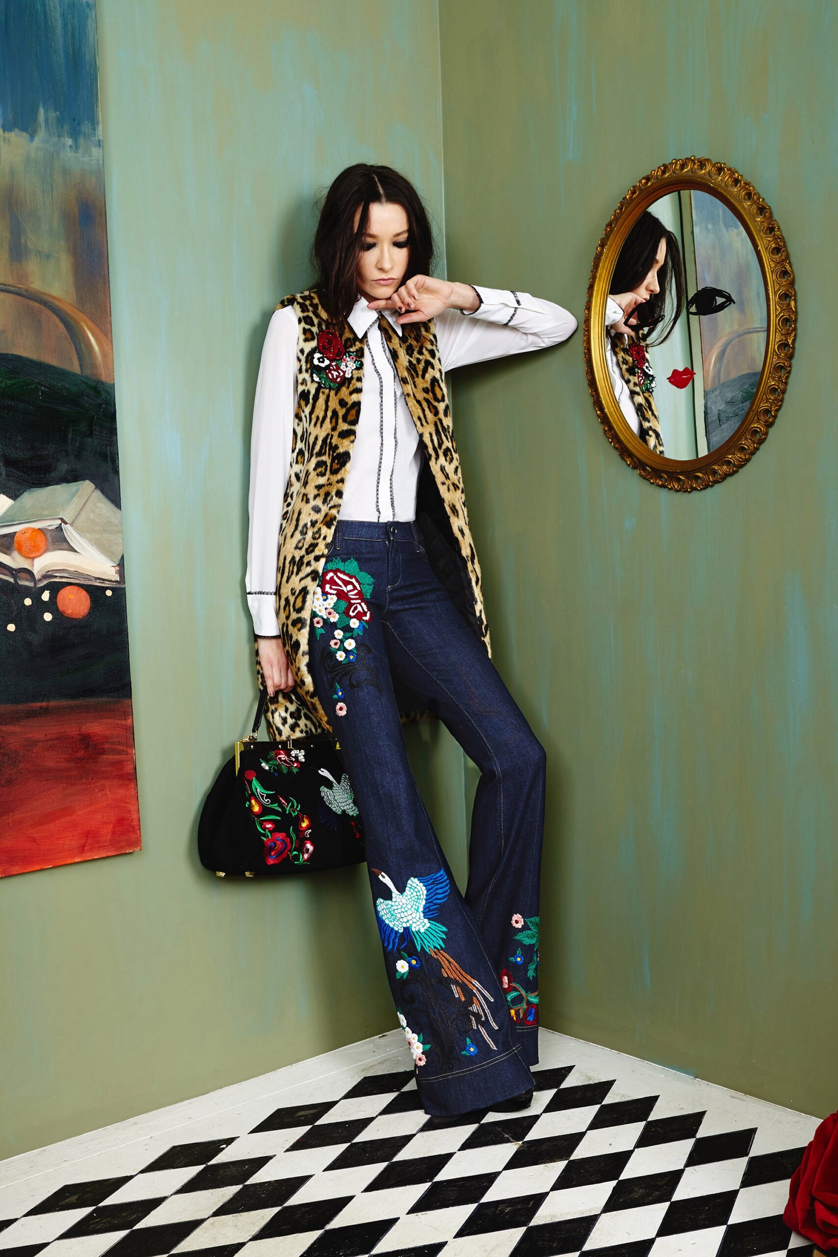 brown faux-fur vest with flared jeans