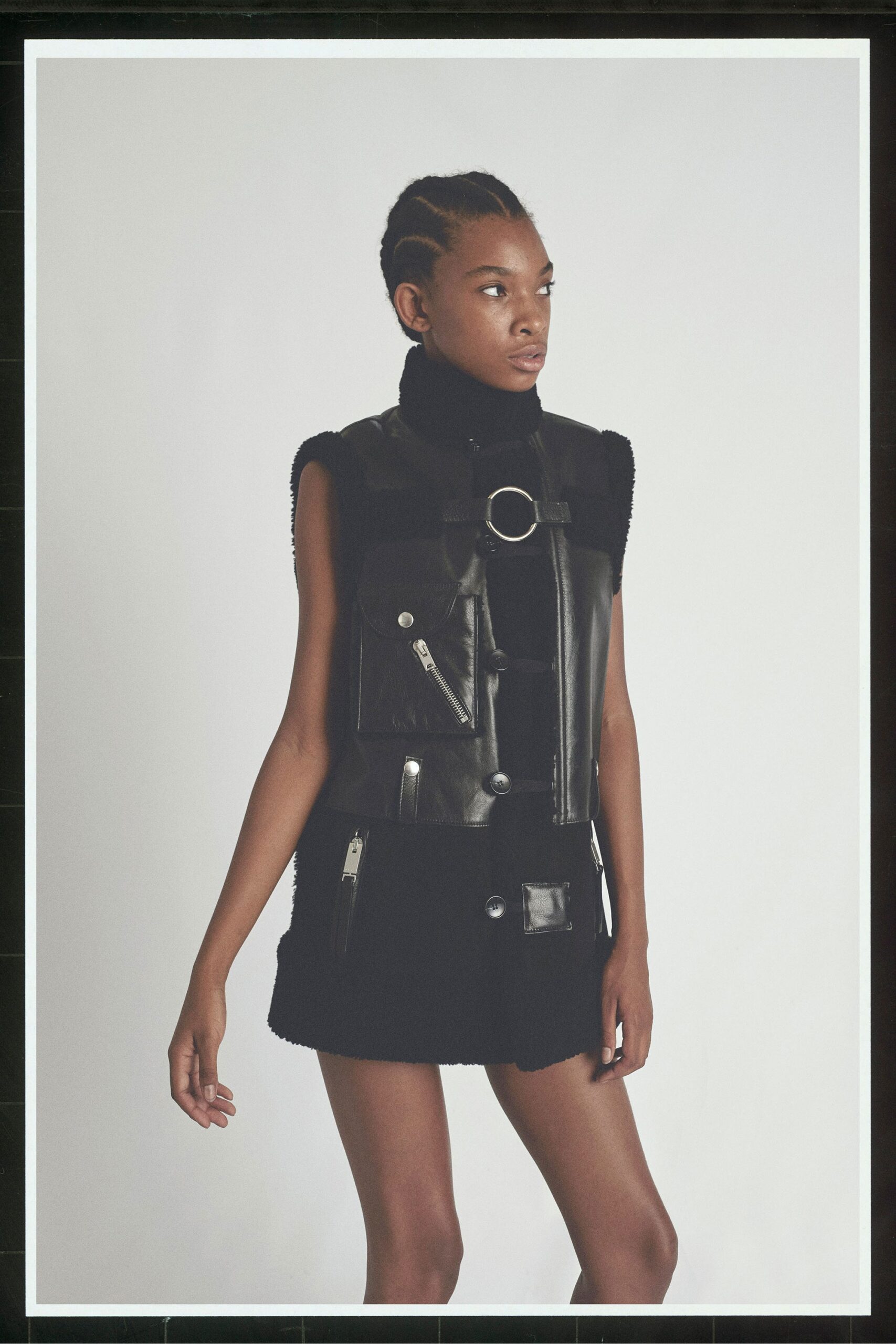 black leather sleeveless high-neck fitted zippered pockets vest