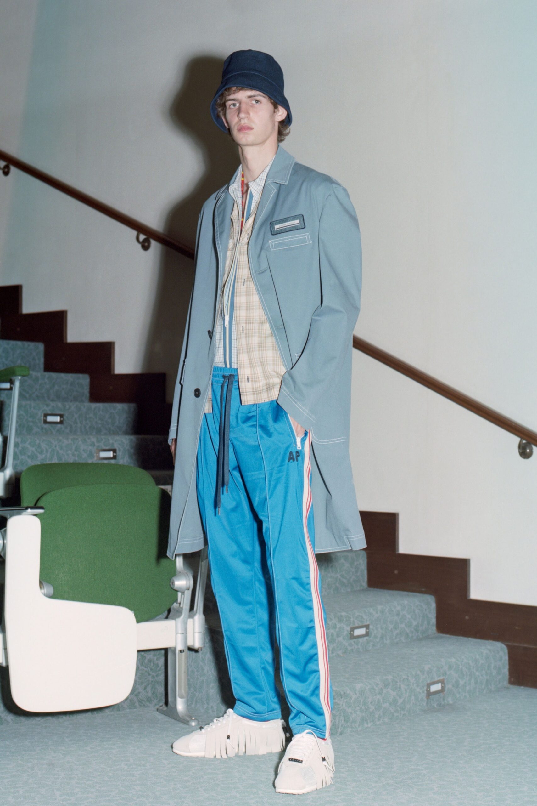 blue relaxed coat with beige shirt
