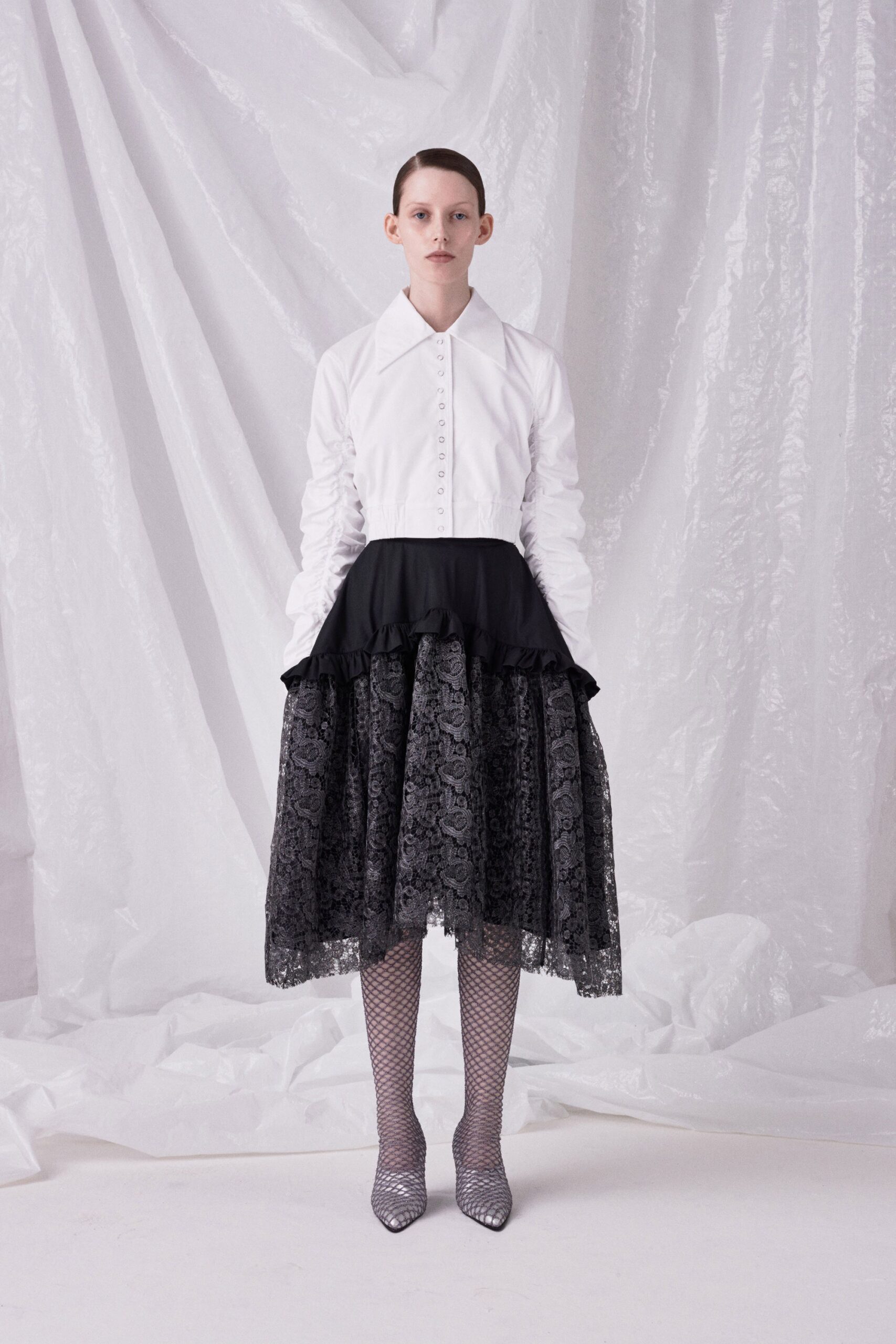 white fitted blouse and black lace skirt
