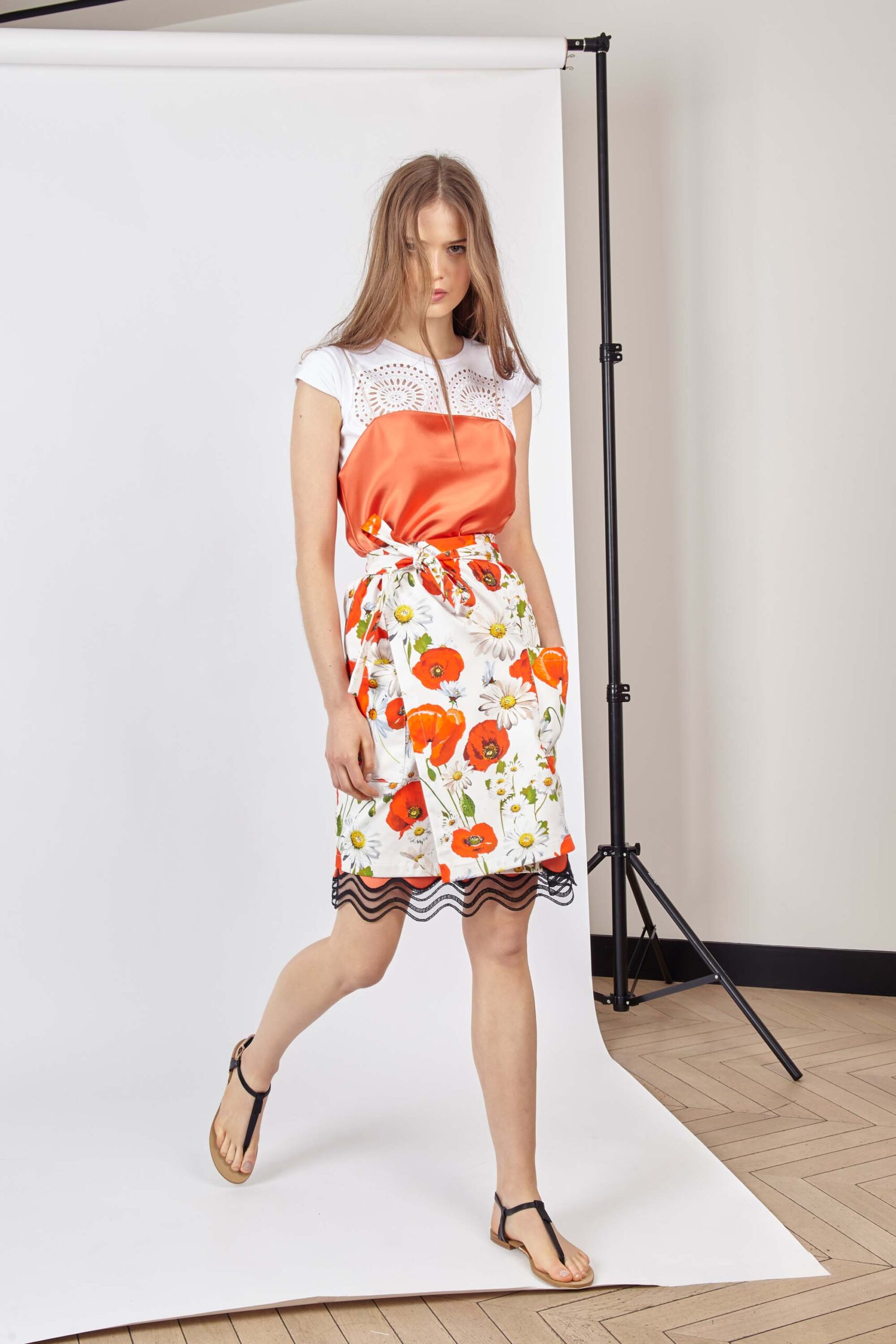 orange and white embroidered top with flared skirt