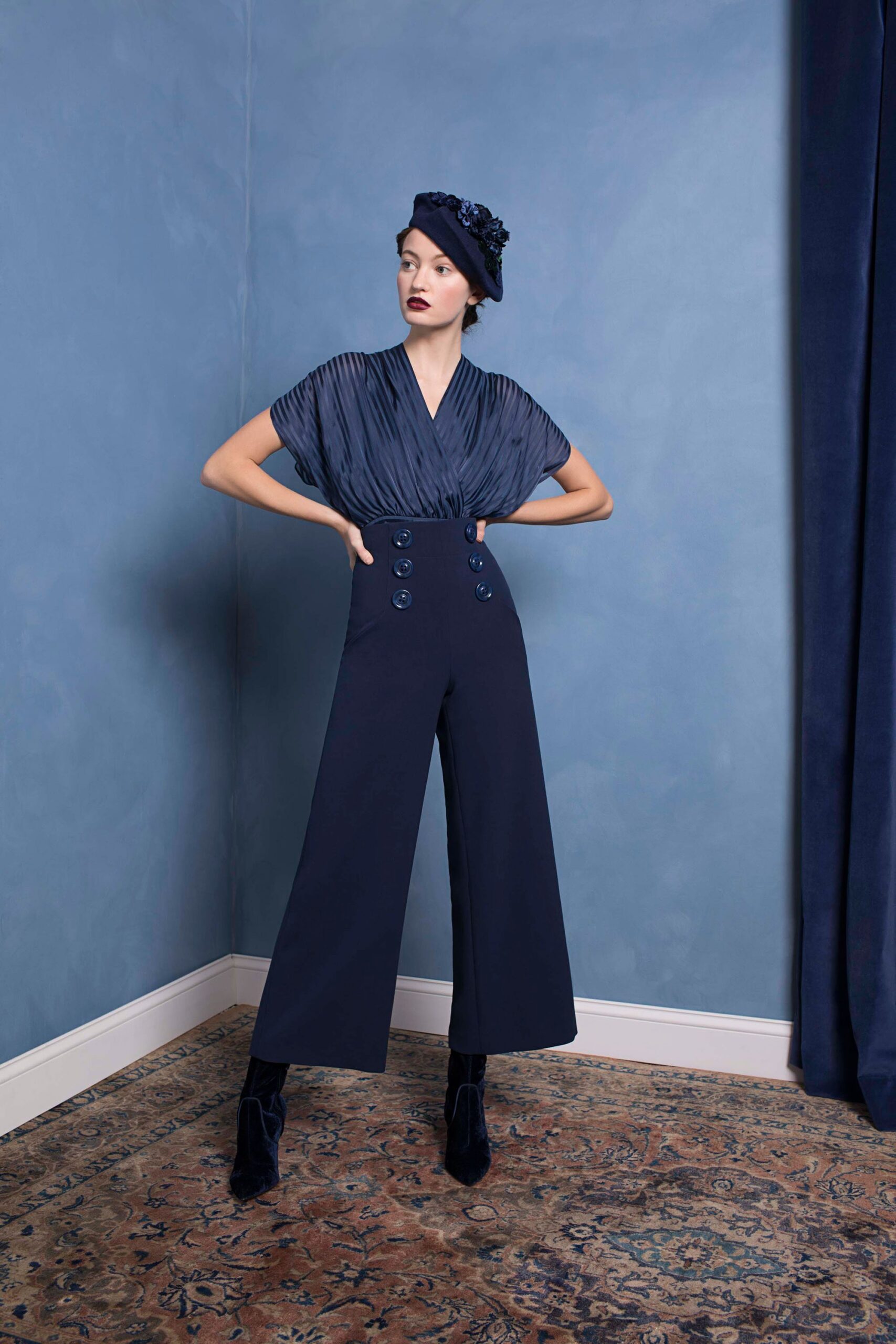 blue pleated top with tailored pants
