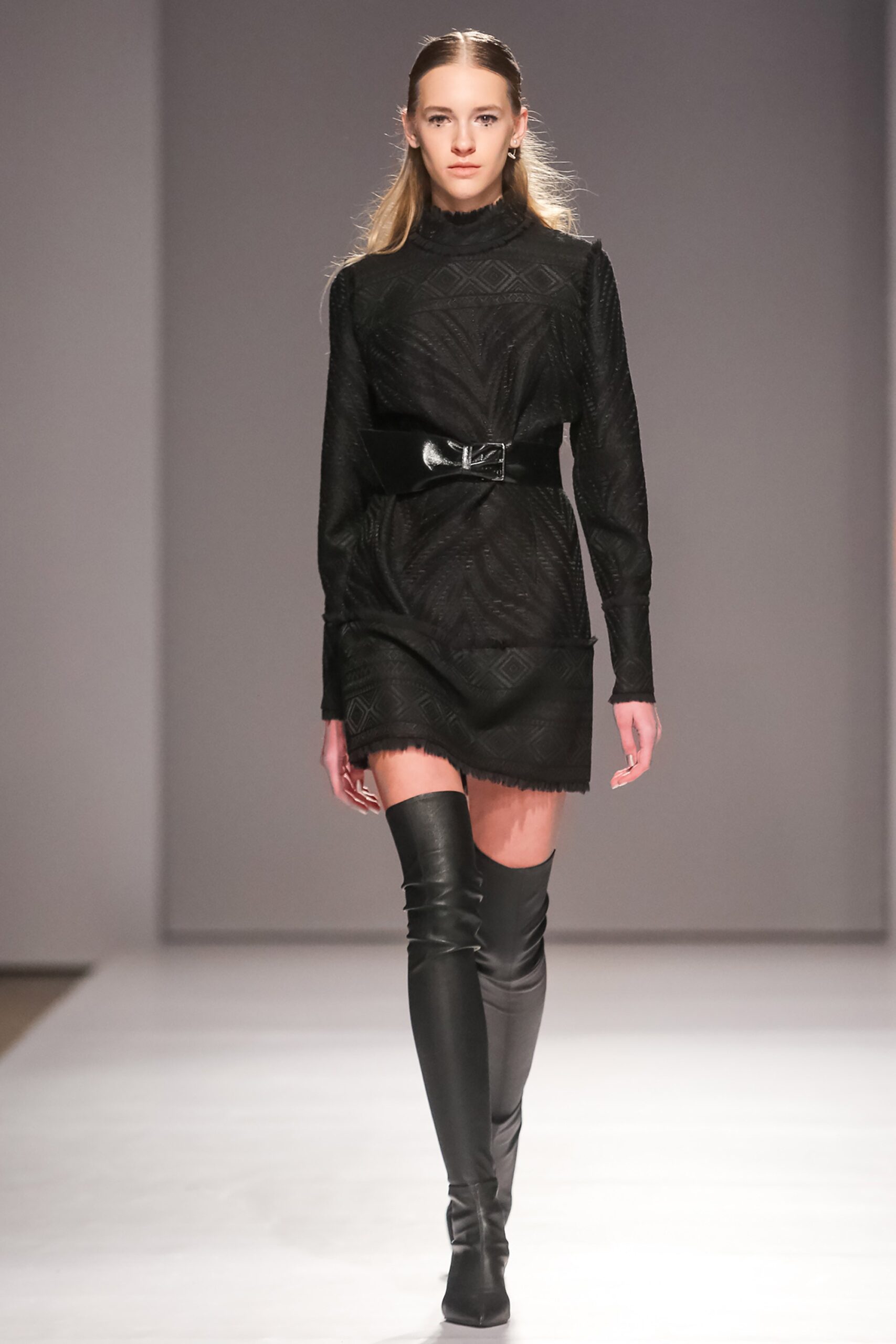 black fitted mini dress with boots