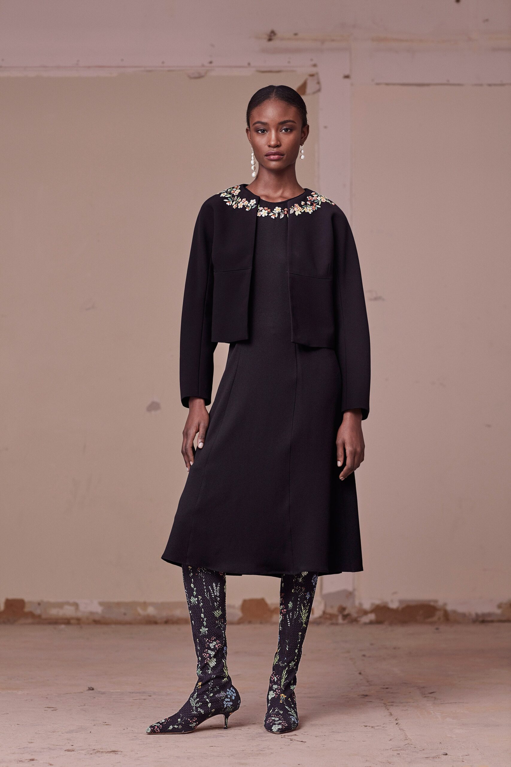 black fitted midi dress with embroidery
