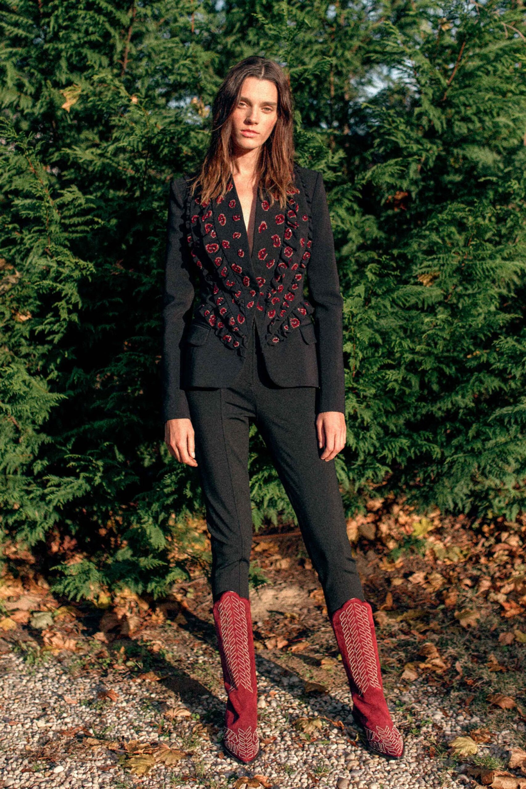 black embroidered blazer with red boots