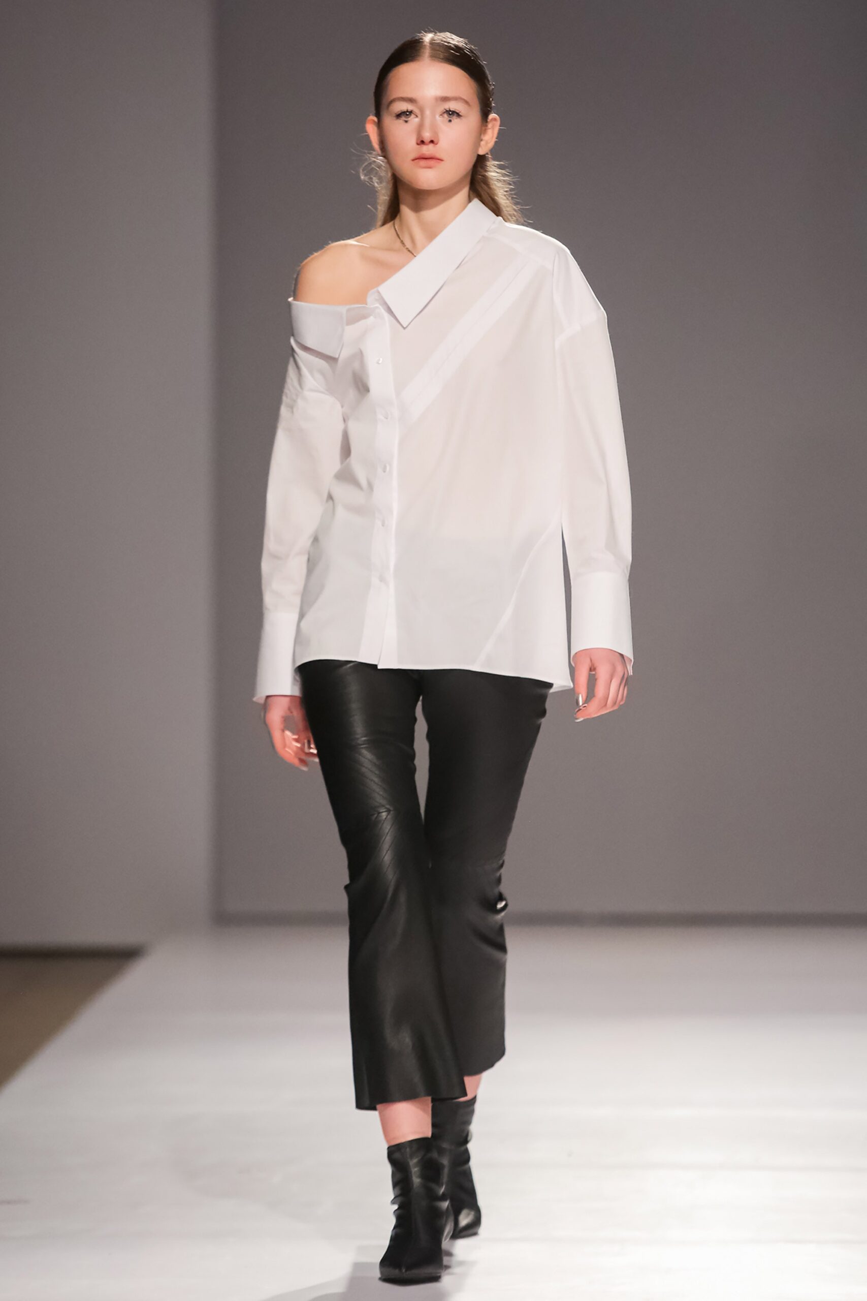 white off-shoulder shirt and black leather pants