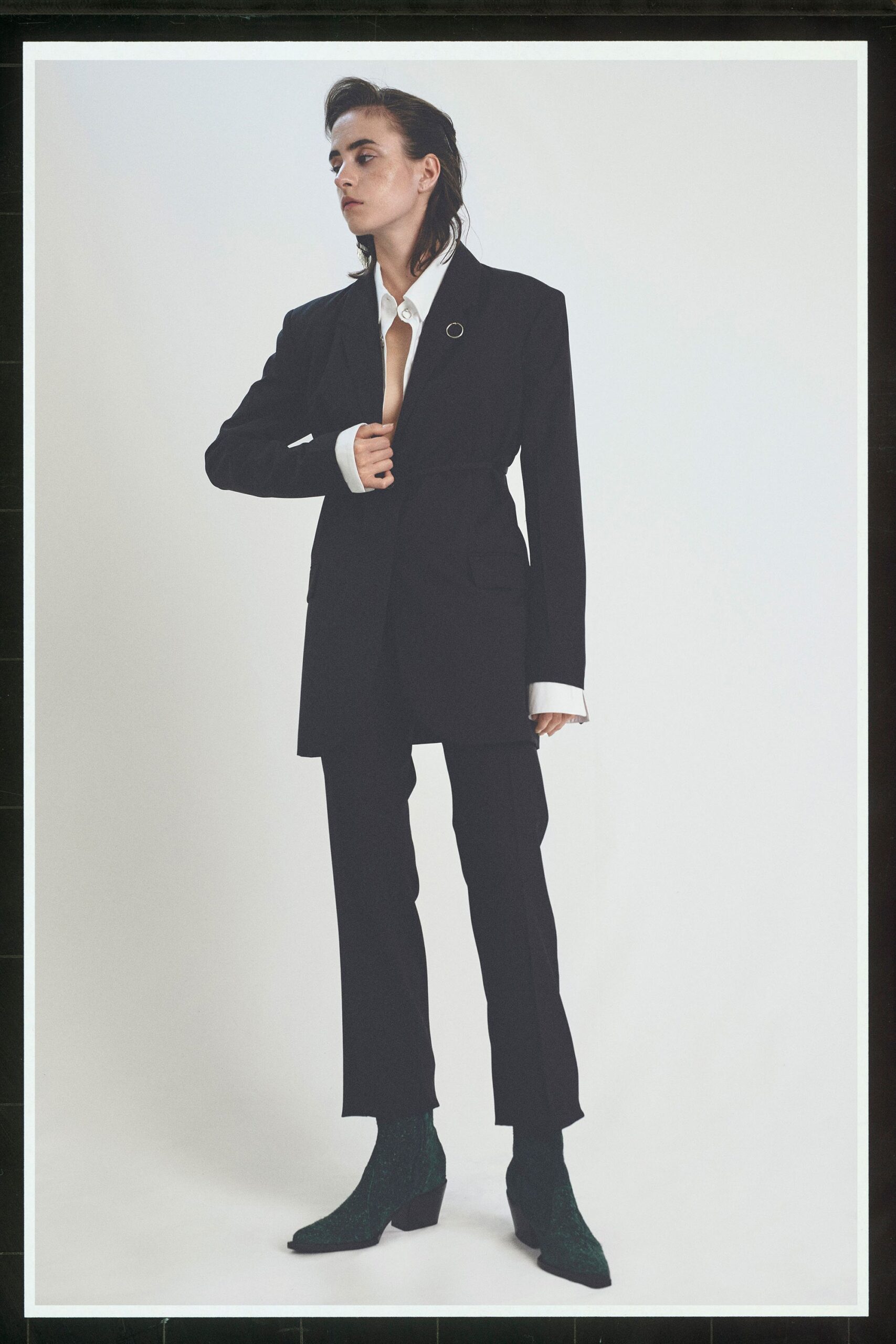 black tailored blazer with slim pants