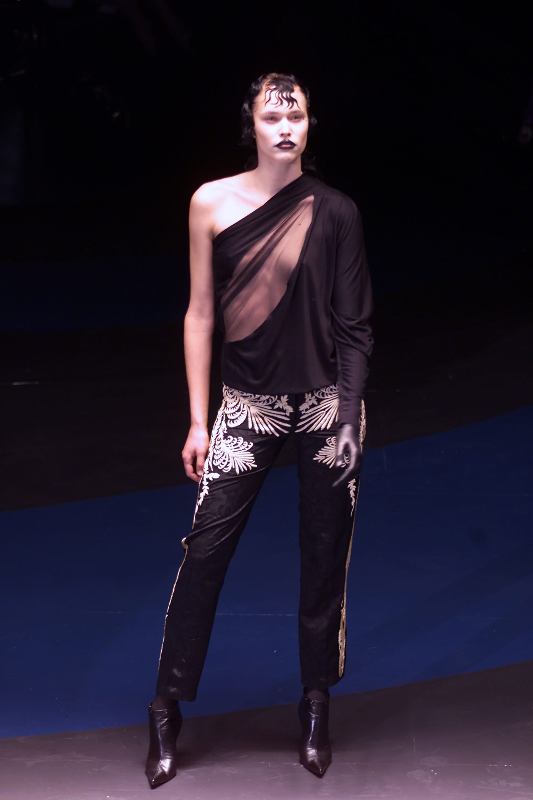 black asymmetric top with embroidered pants