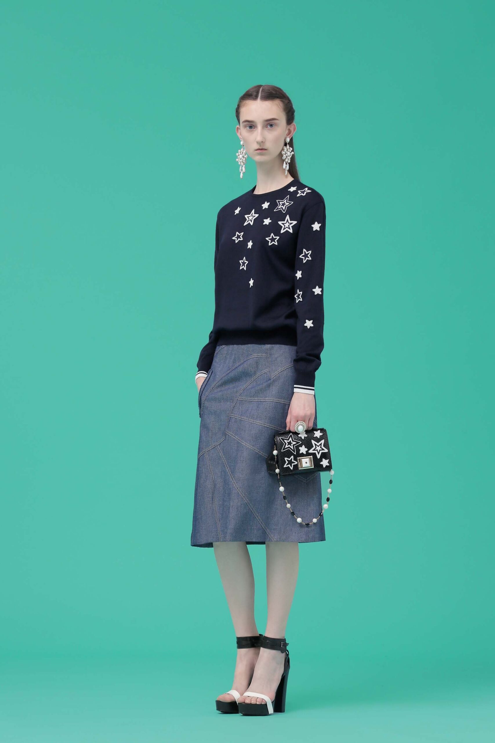 black embroidered sweater and blue denim skirt