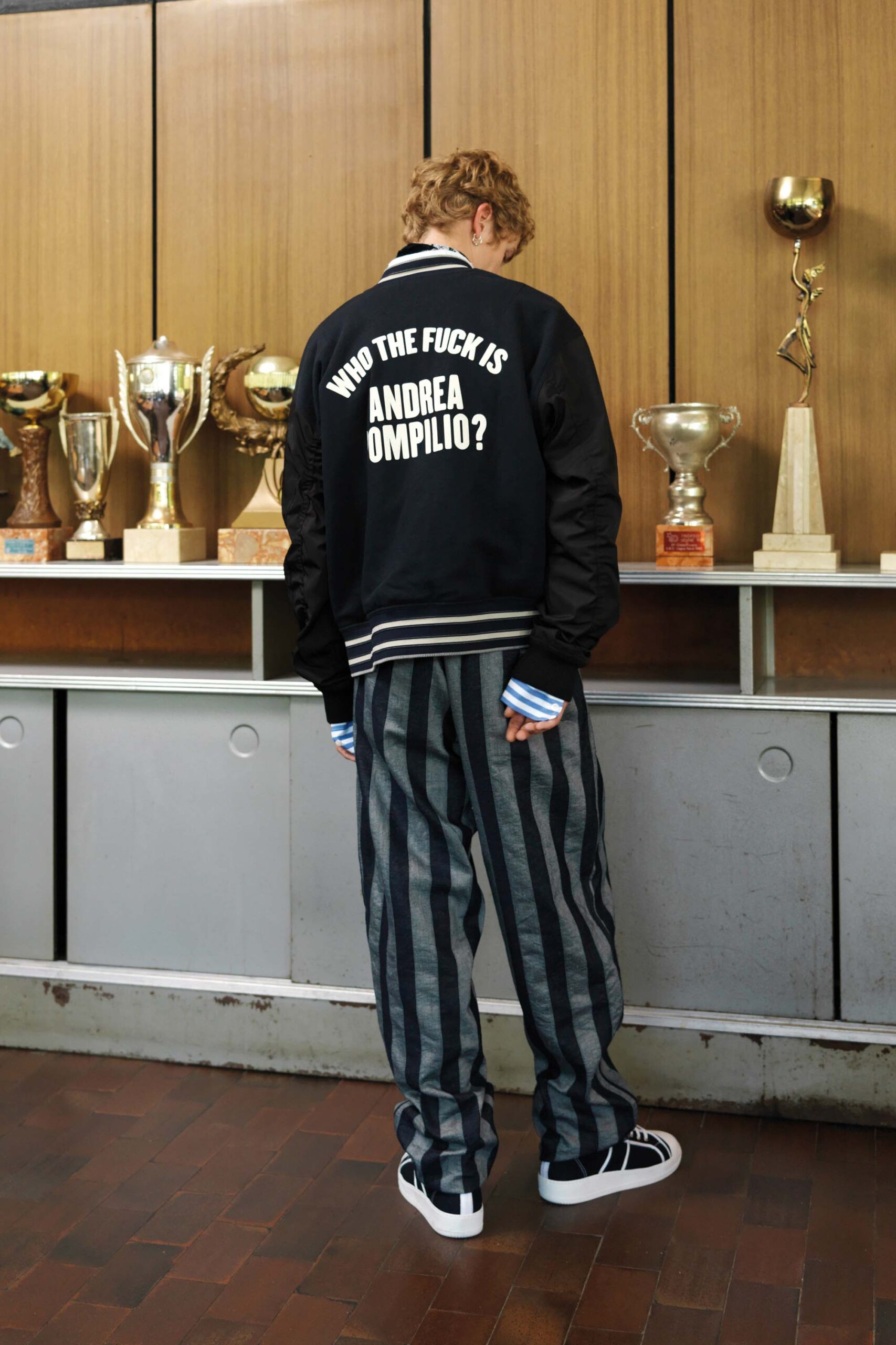 black relaxed jacket with striped pants