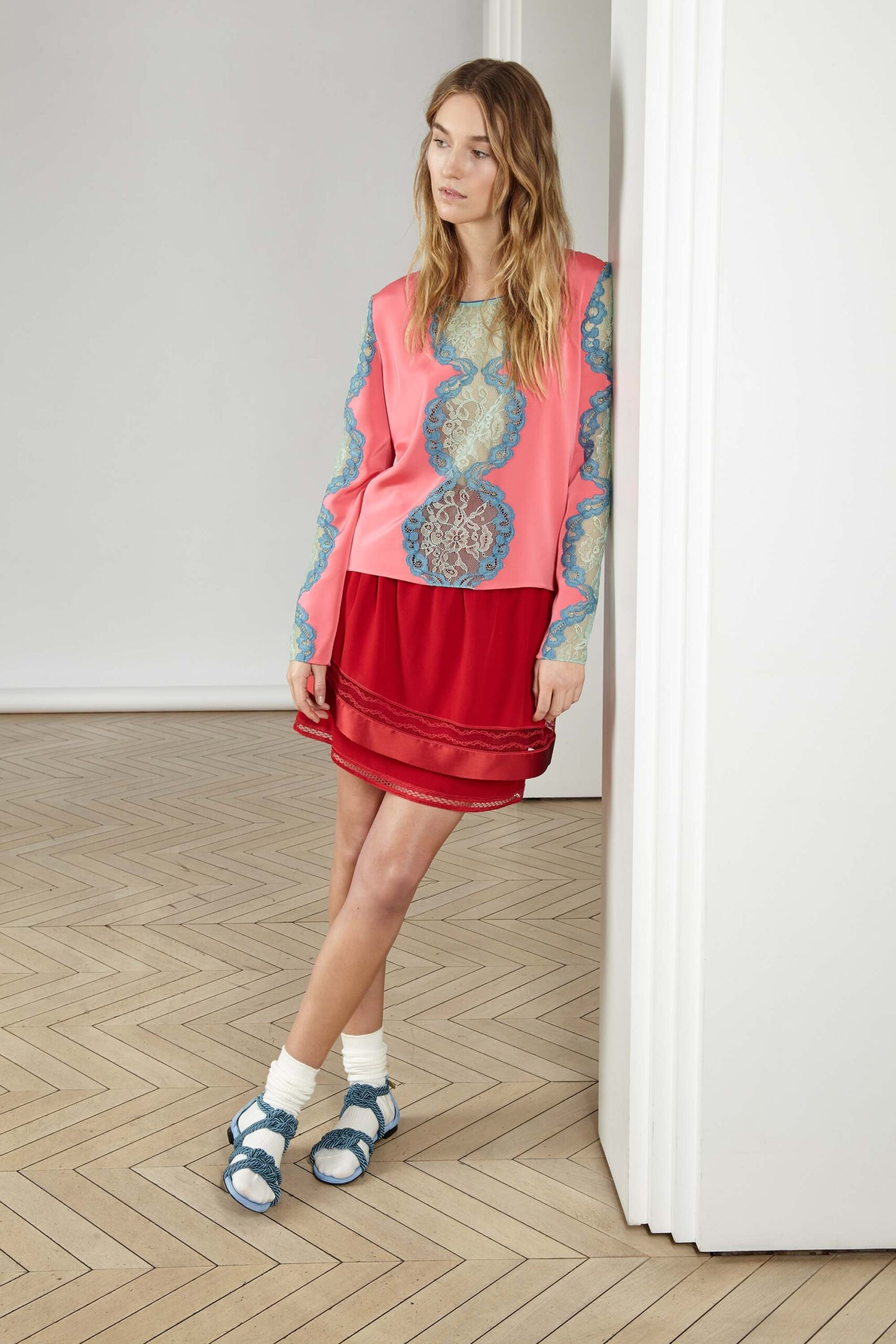 pink printed top with red mini skirt