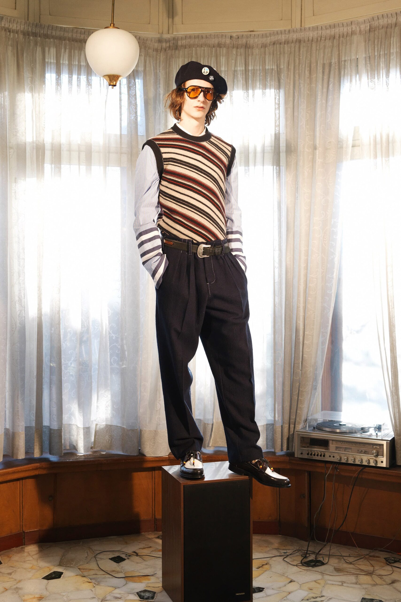 multi-striped sleeveless sweater with tailored pants