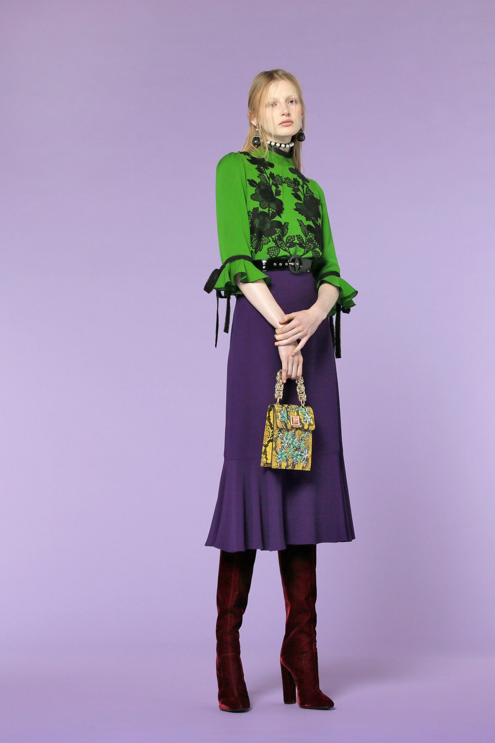 green embroidered blouse and purple skirt