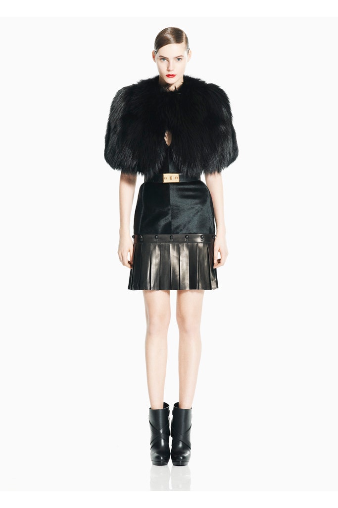 black fur cape and pleated skirt