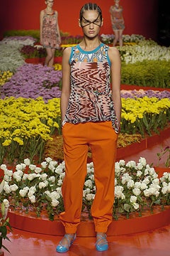 multi-colored sleeveless top and orange pants