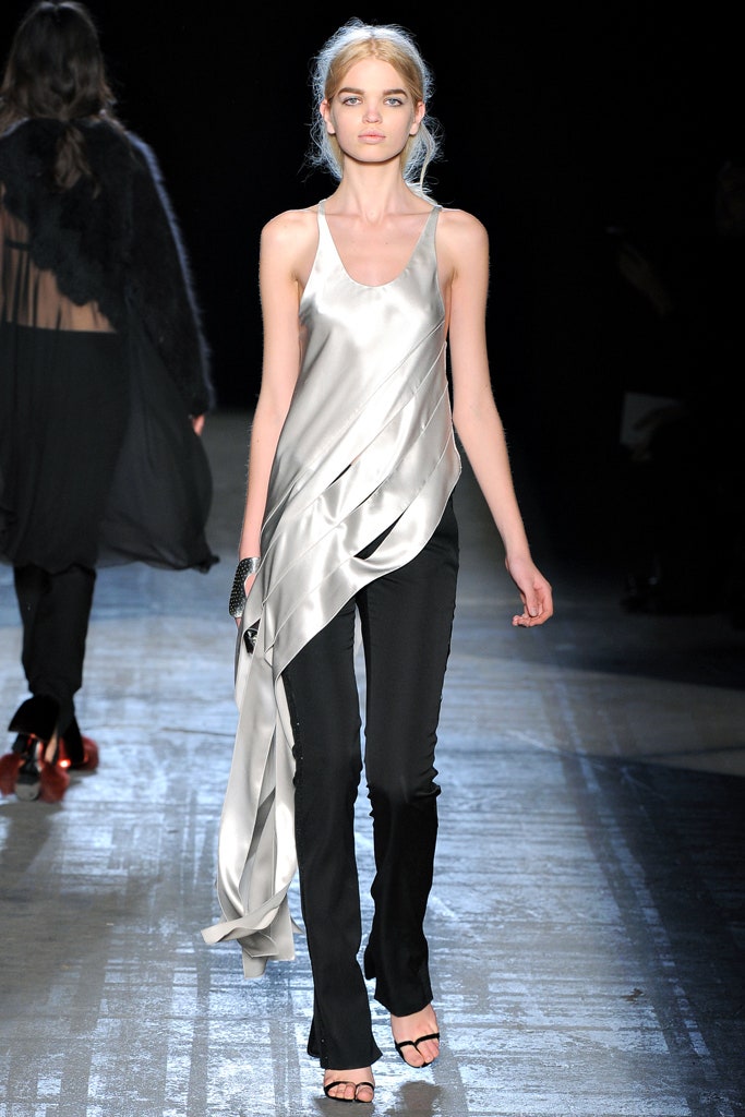 silver draped top with black pants