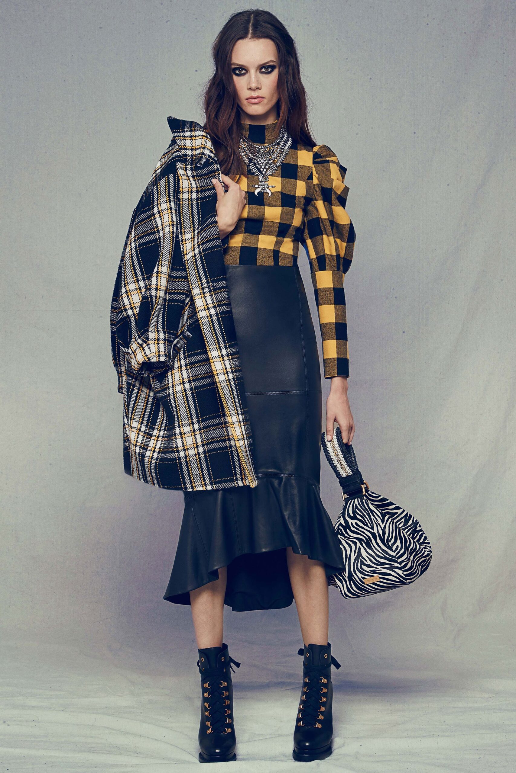yellow black checked top with leather skirt
