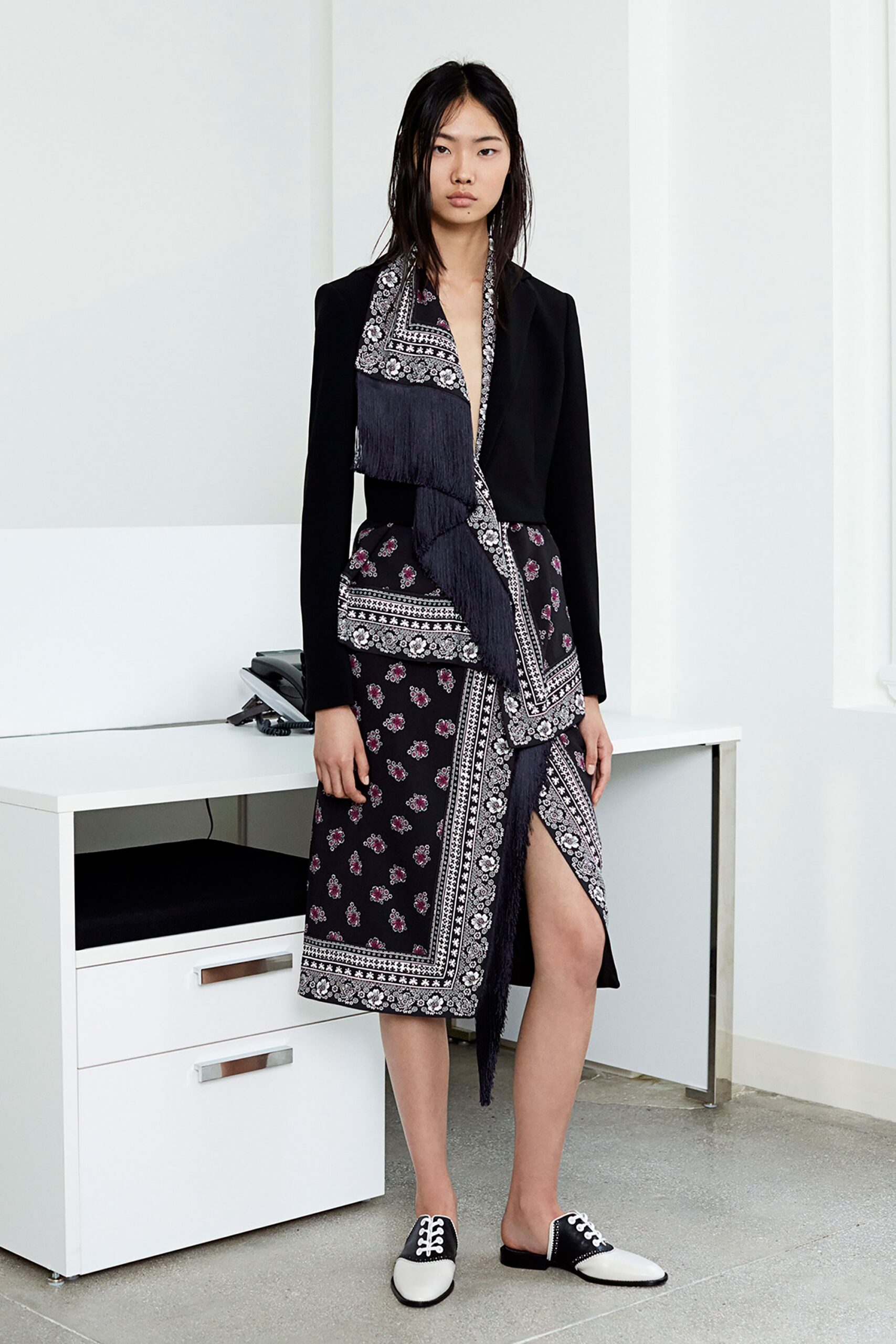 black tailored blazer and printed skirt