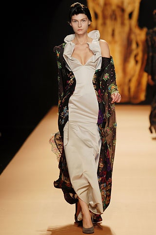 silver silk fitted gown with black cape