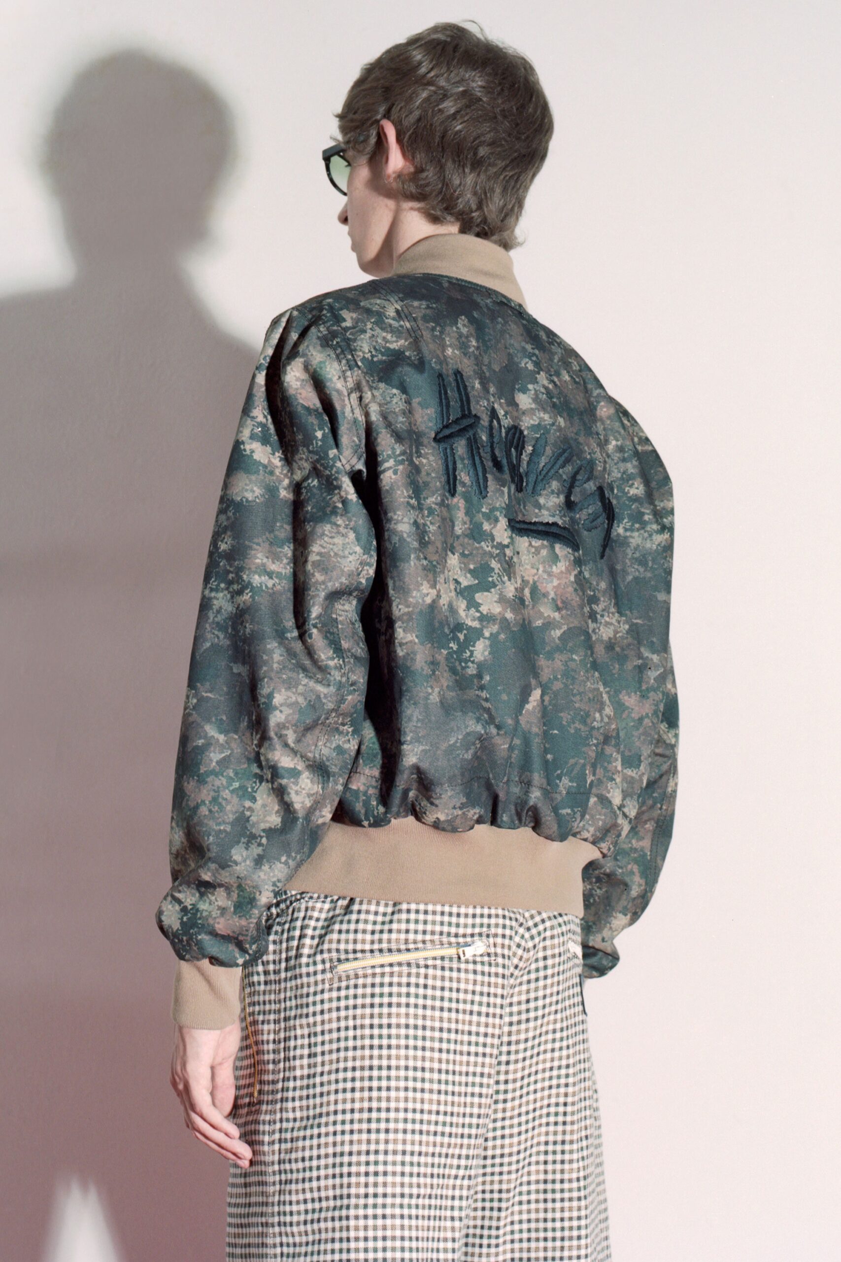relaxed green jacket with checked pants