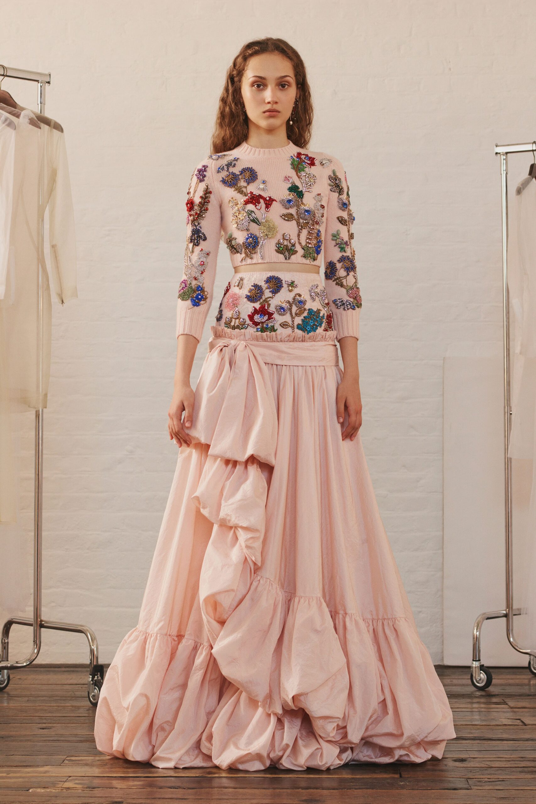 embroidered white top with pink skirt