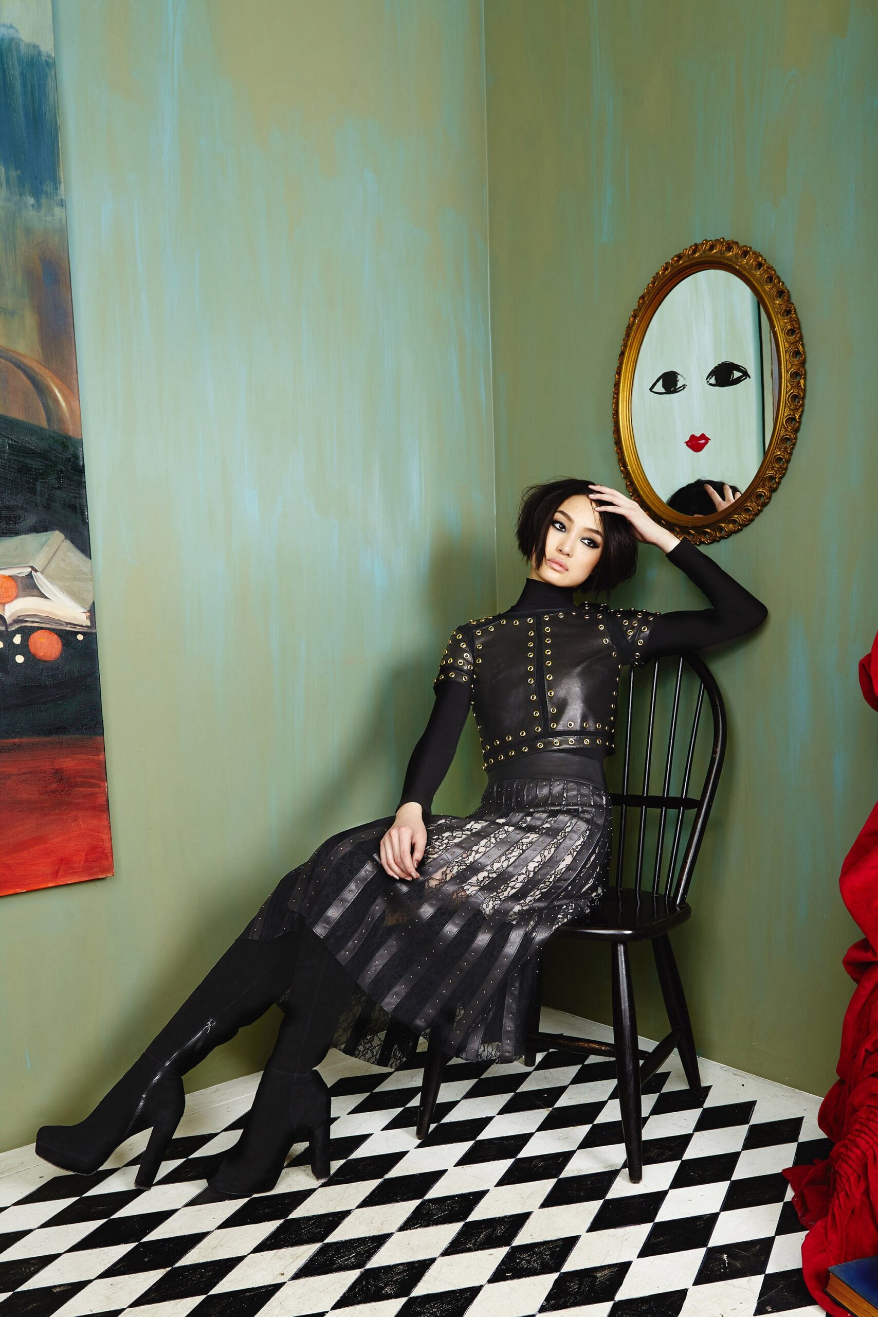 black leather embellished top and pleated skirt