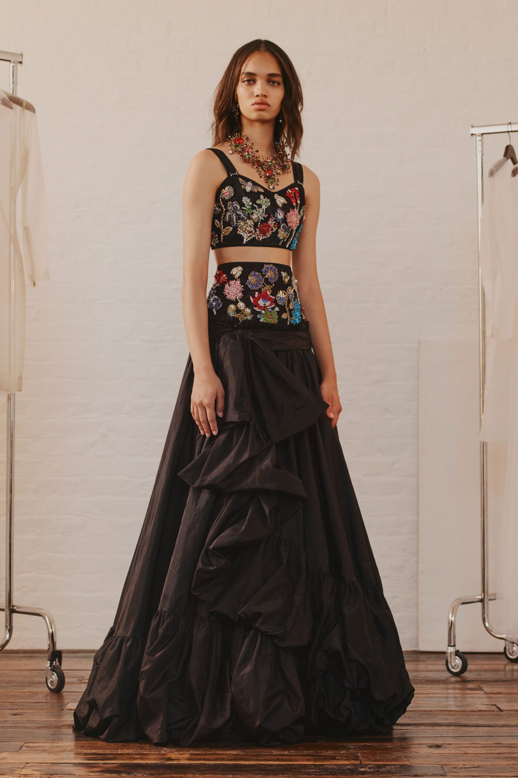black embroidered top and ruffled skirt