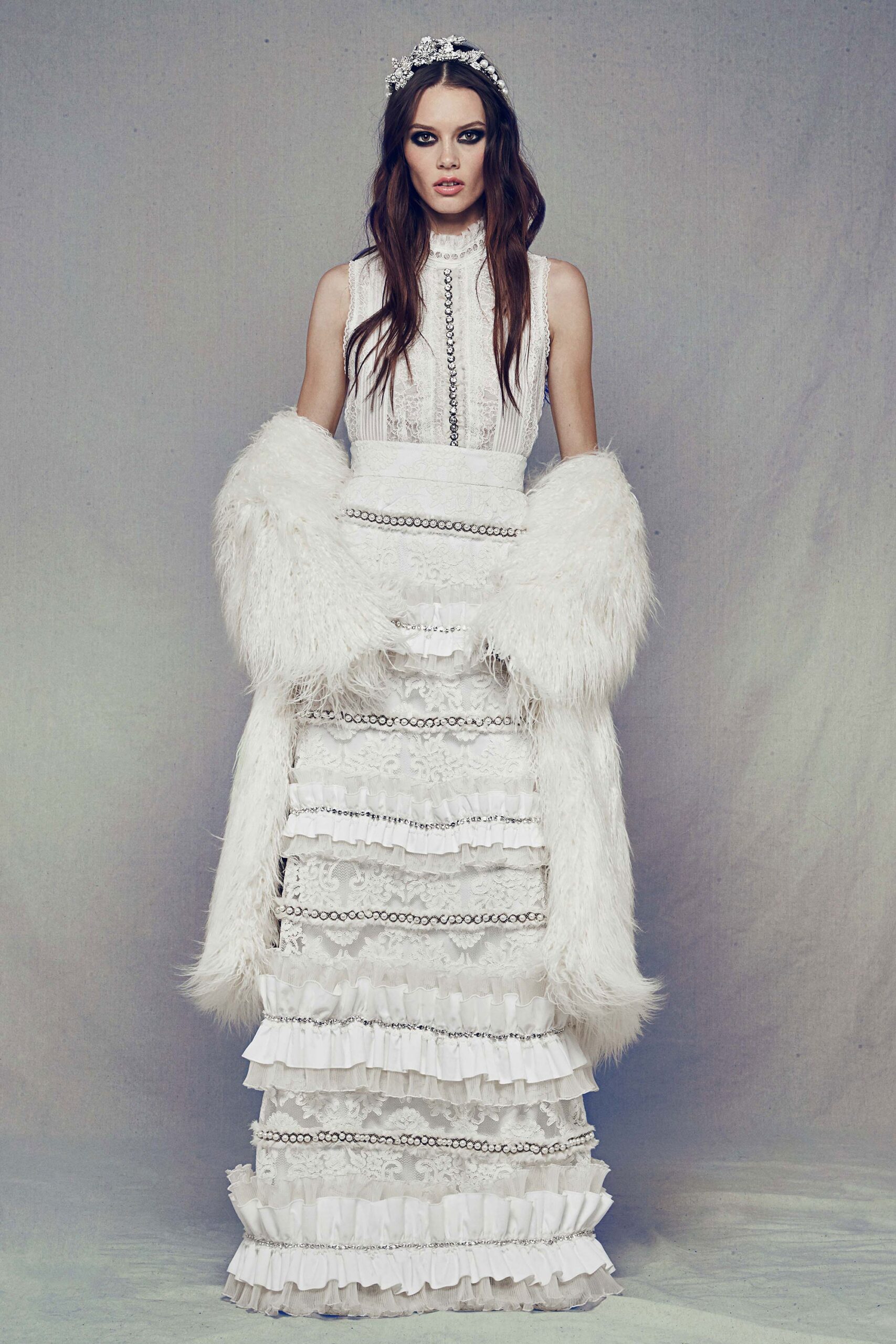 white silk ruffled gown with fur cape