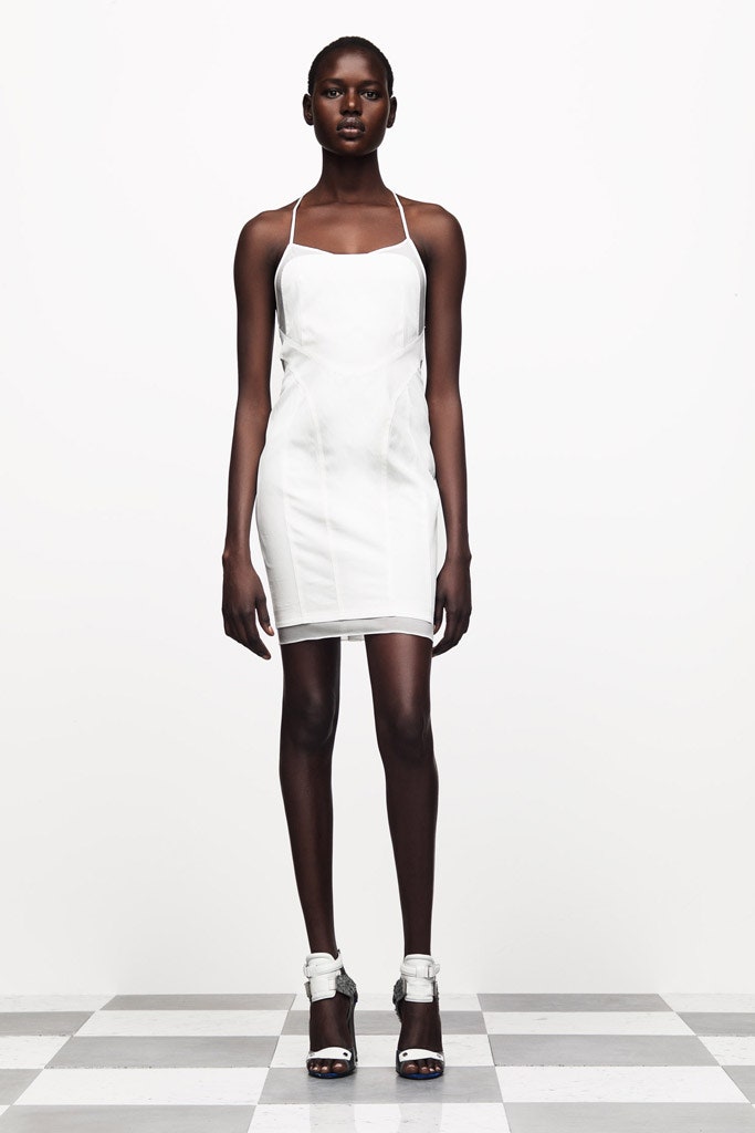 white fitted mini dress with silver shoes