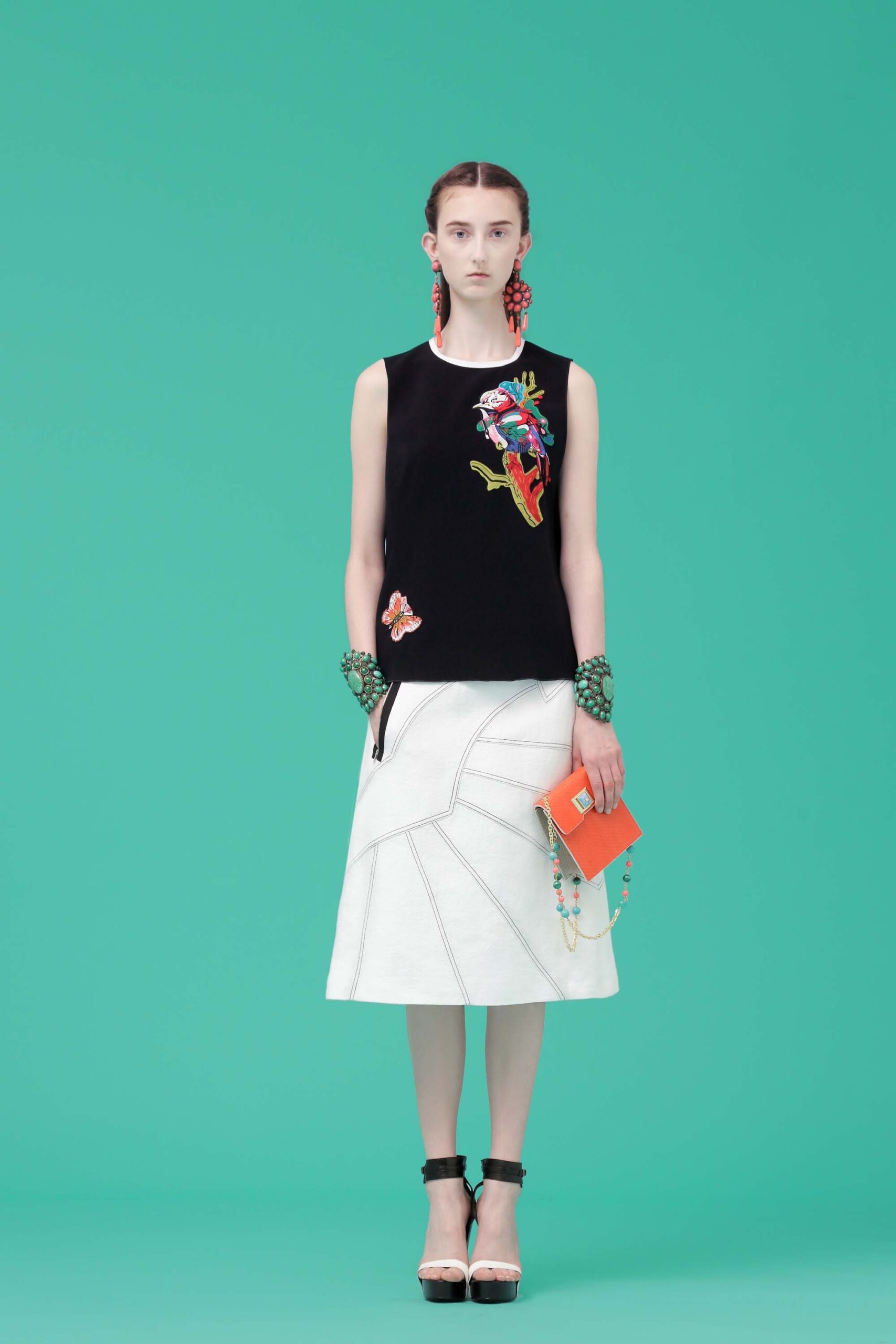 black fitted sleeveless top and white midi skirt